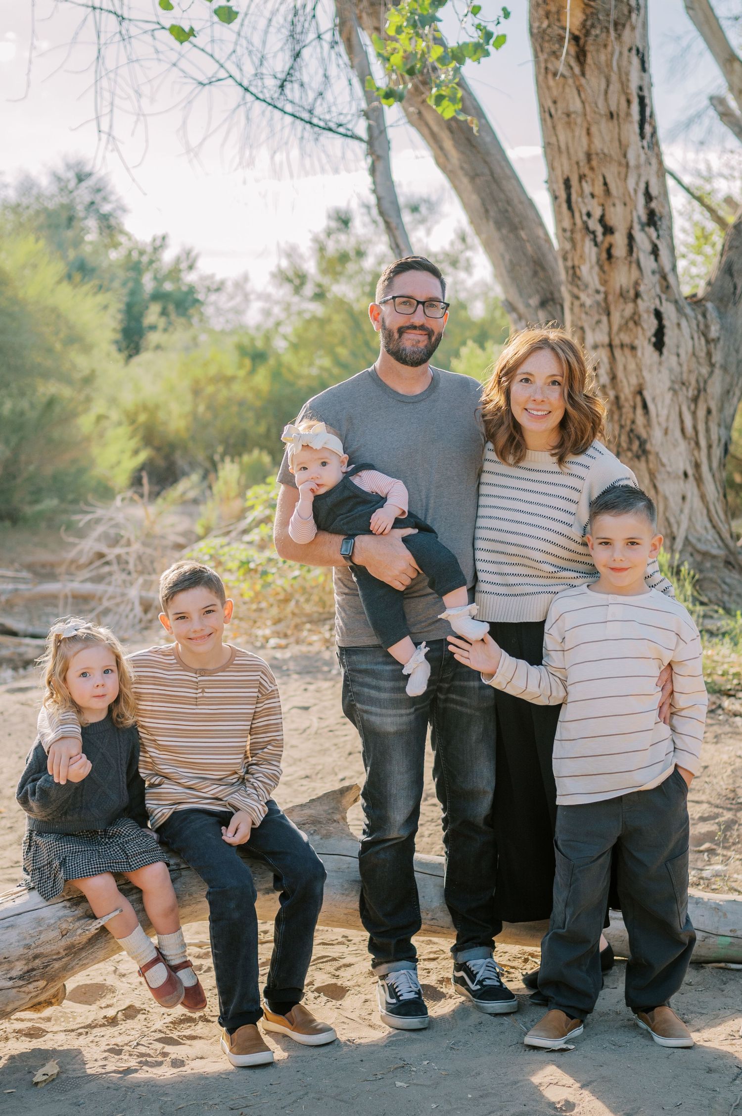 Luxury Gilbert Arizona family photography surrounded by lush greenery. A relaxed, stress-free experience that captures real connection.