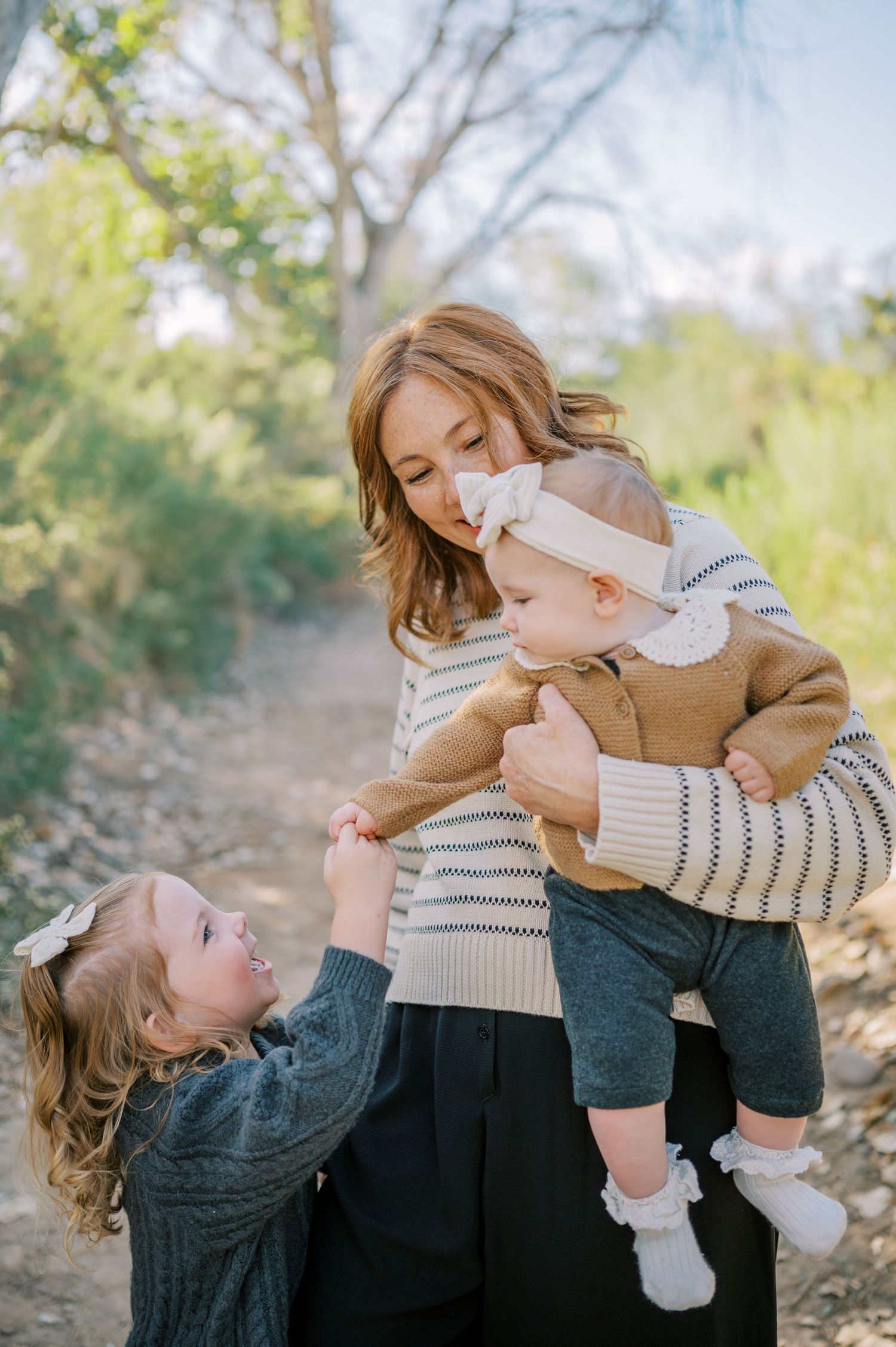 Luxury Gilbert Arizona family photography surrounded by lush greenery. A relaxed, stress-free experience that captures real connection.