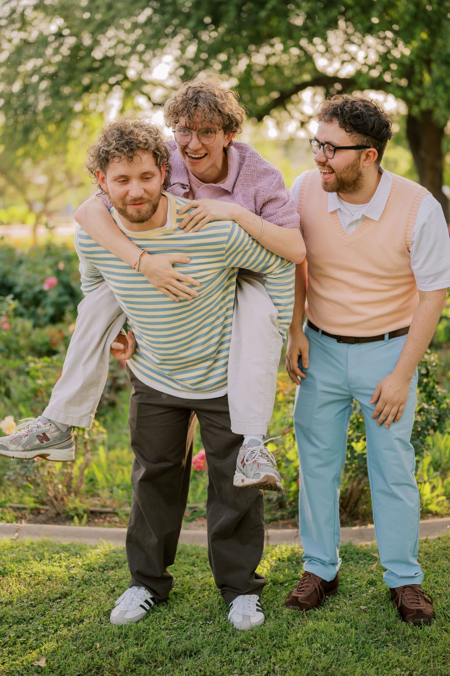 Candid extended family moment in a vibrant rose garden landscape