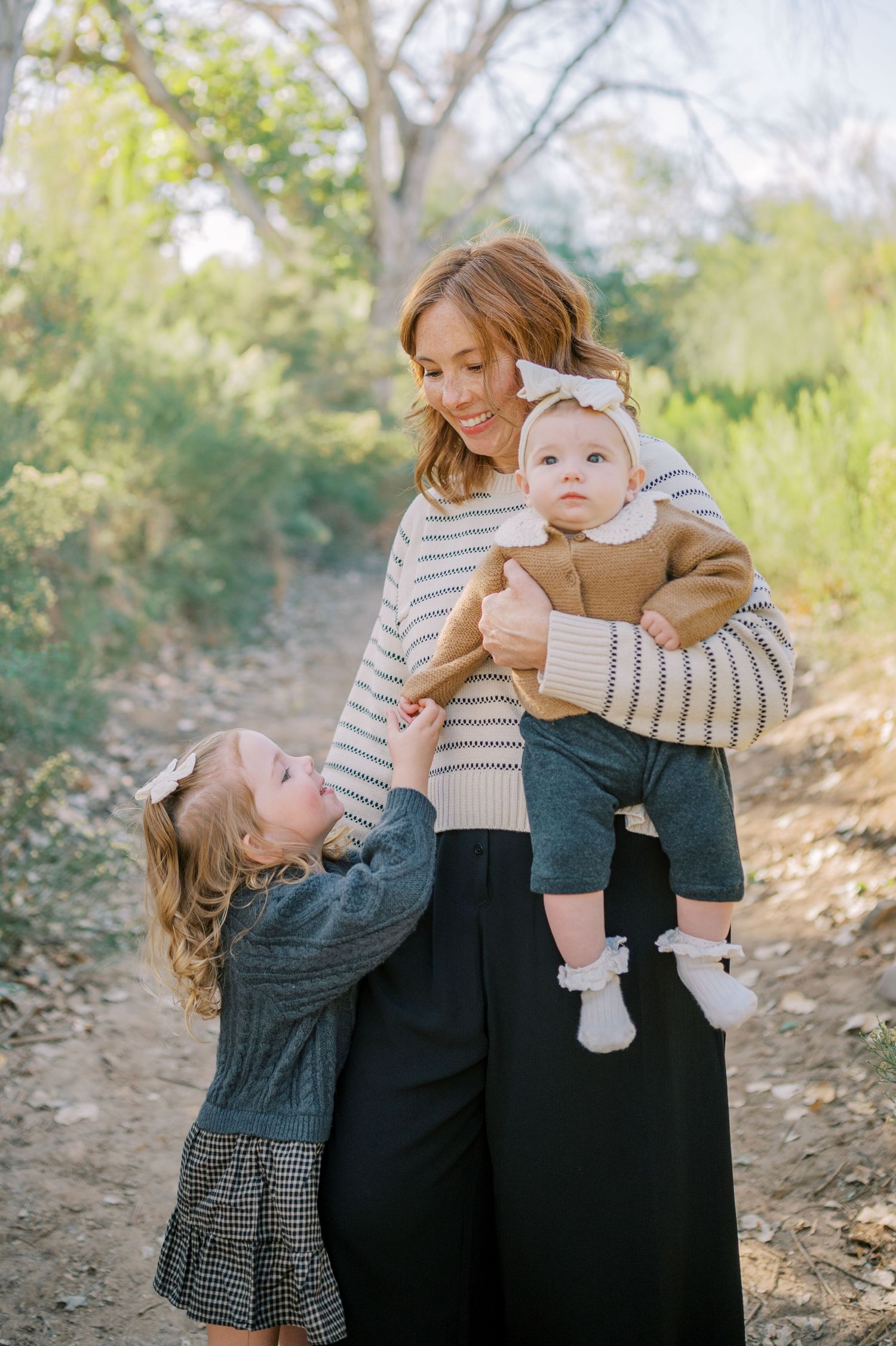 Luxury Gilbert Arizona family photography surrounded by lush greenery. A relaxed, stress-free experience that captures real connection.