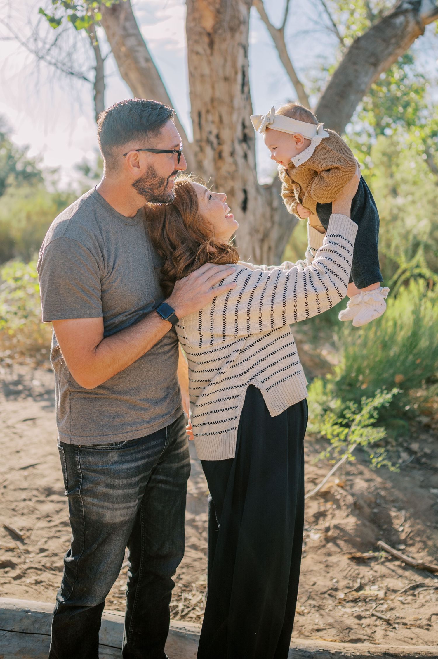 Luxury Gilbert Arizona family photography surrounded by lush greenery. A relaxed, stress-free experience that captures real connection.
