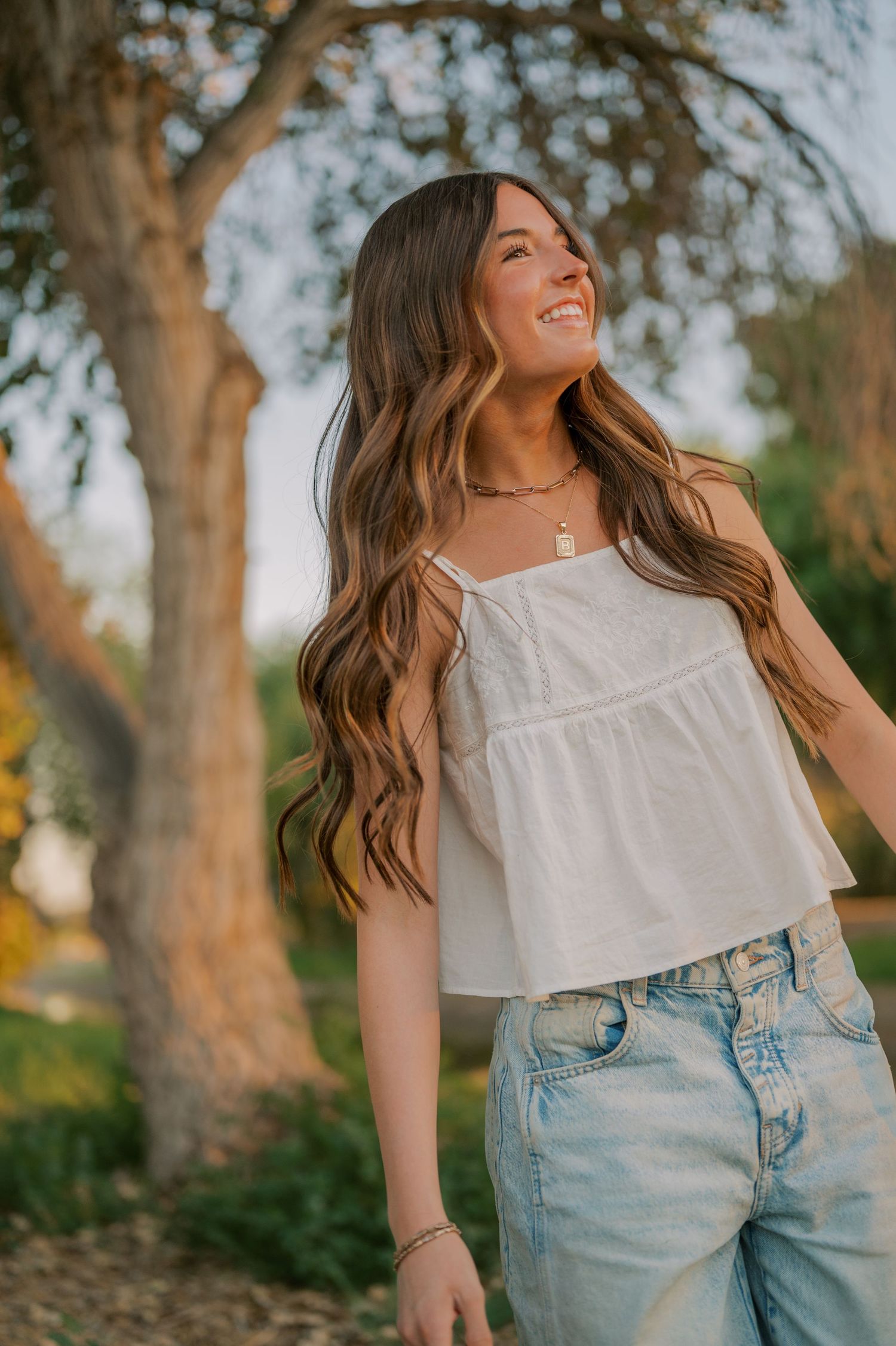 Arizona senior photographer capturing natural beauty in a tree-lined canal