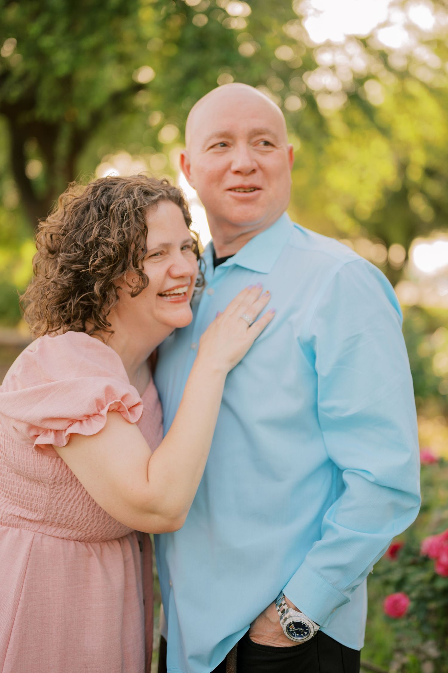 Extended family portrait in a blooming rose garden in Gilbert Arizona