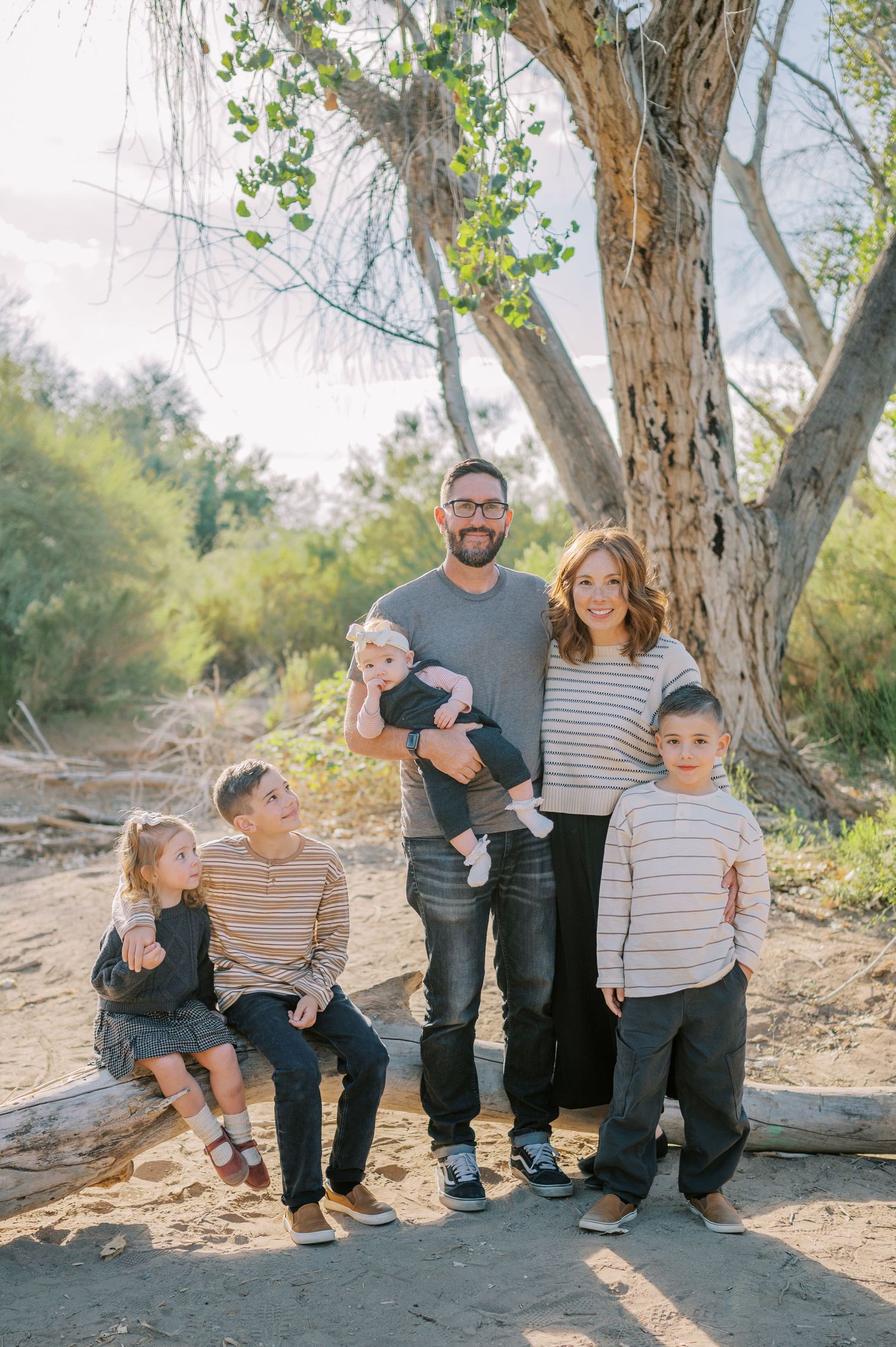 Luxury Gilbert Arizona family photography surrounded by lush greenery. A relaxed, stress-free experience that captures real connection.