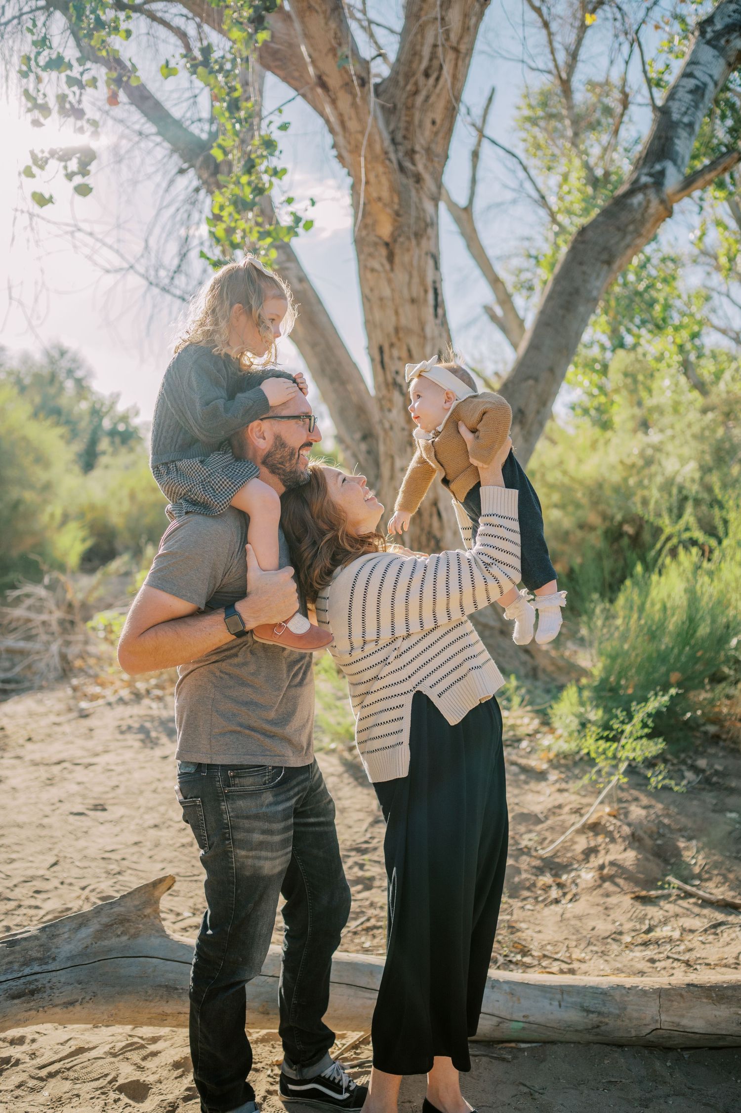 Luxury Gilbert Arizona family photography surrounded by lush greenery. A relaxed, stress-free experience that captures real connection.