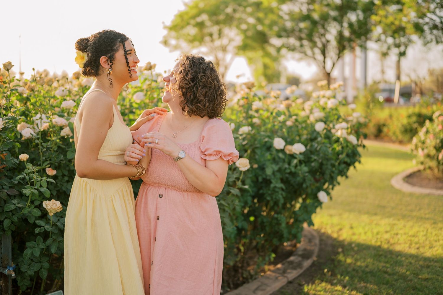 Candid extended family moment in a vibrant rose garden landscape