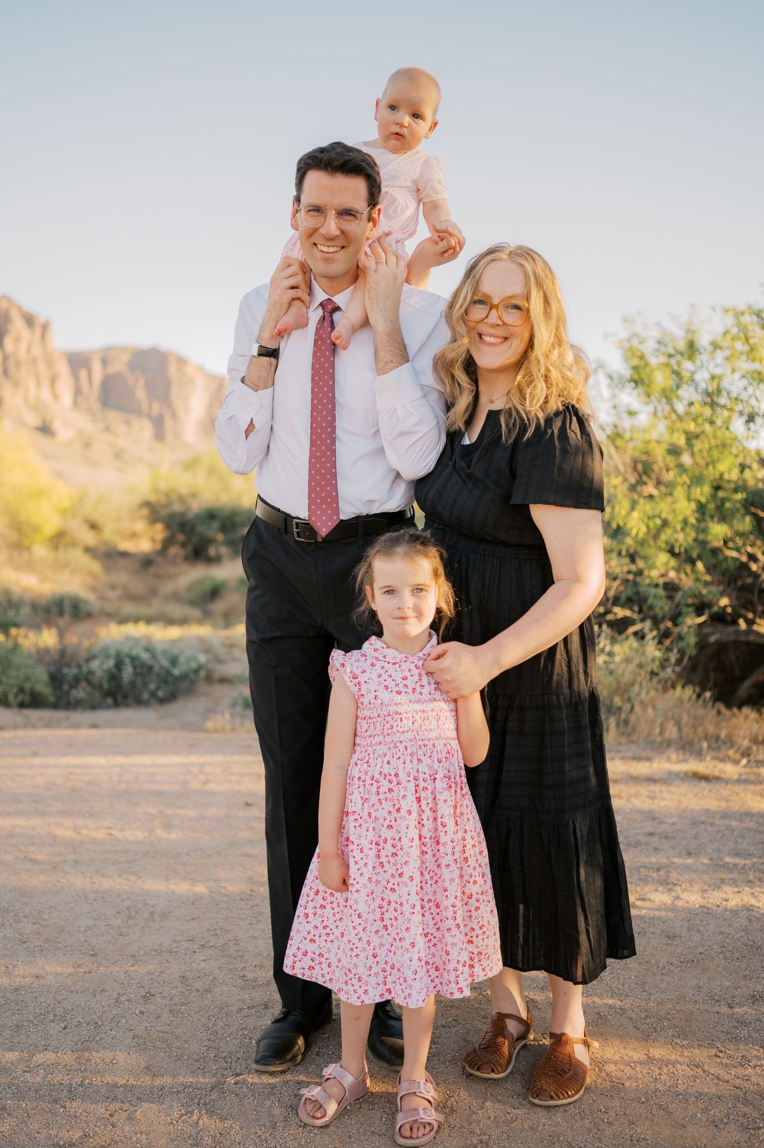 Elegant family portrait in Arizona desert landscape at sunset