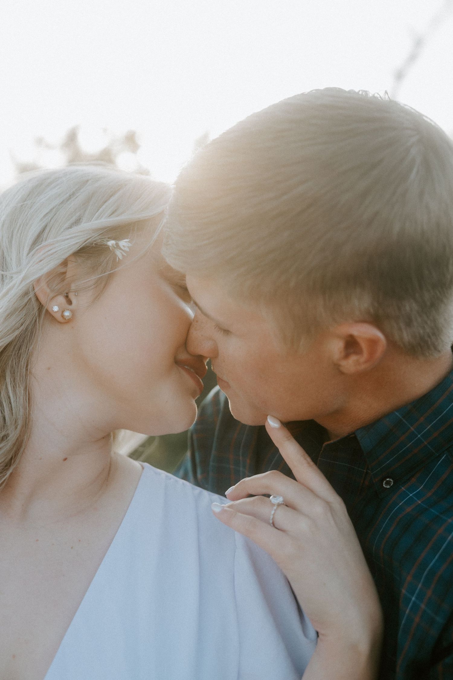Romantic close-up portraits in dreamy sunlight with soft focus.