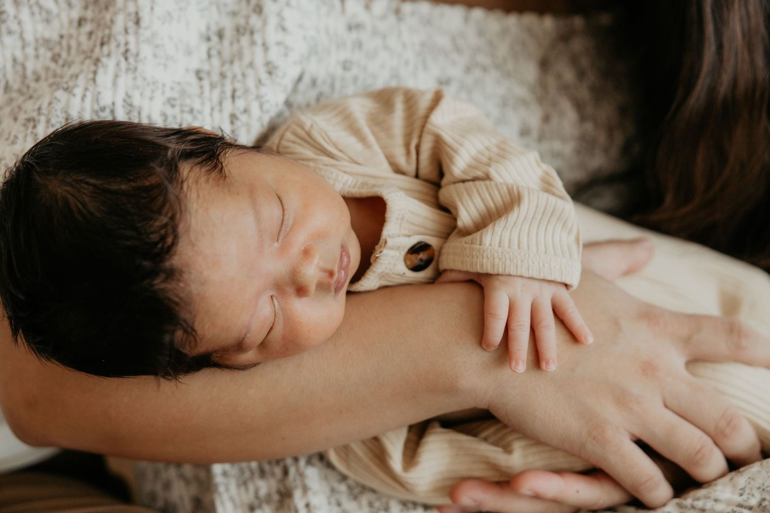 Intimate family portrait session with gentle embraces.