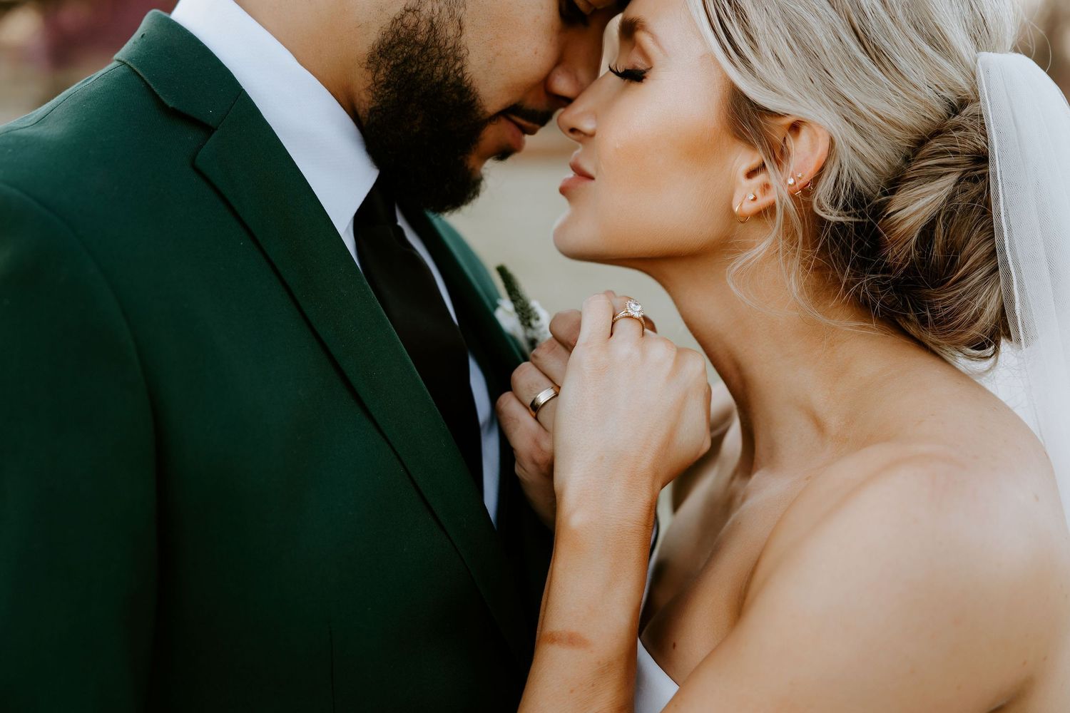 Intimate wedding portrait series showing tender moments between newlyweds.