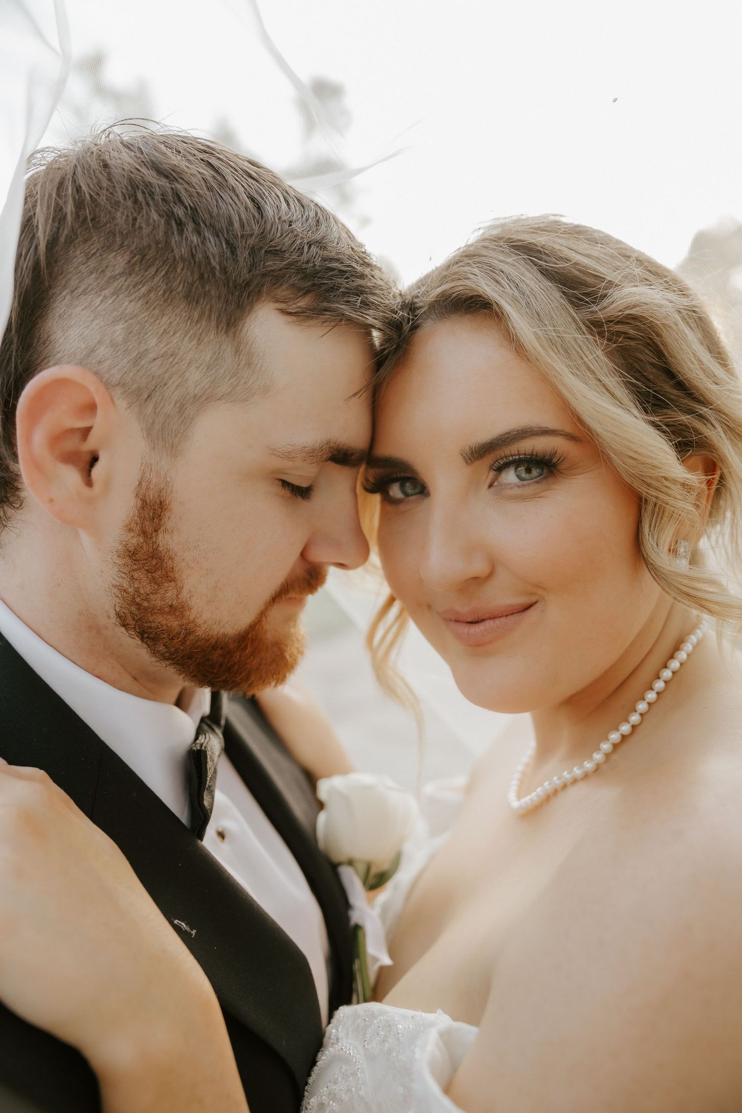 Intimate wedding portrait sequence showing tender romantic moments between a couple in formal attire.