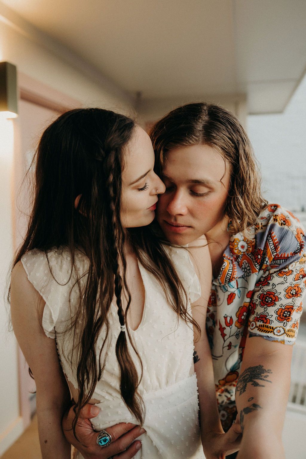 Intimate close-up series of a couple sharing tender moments in natural light.
