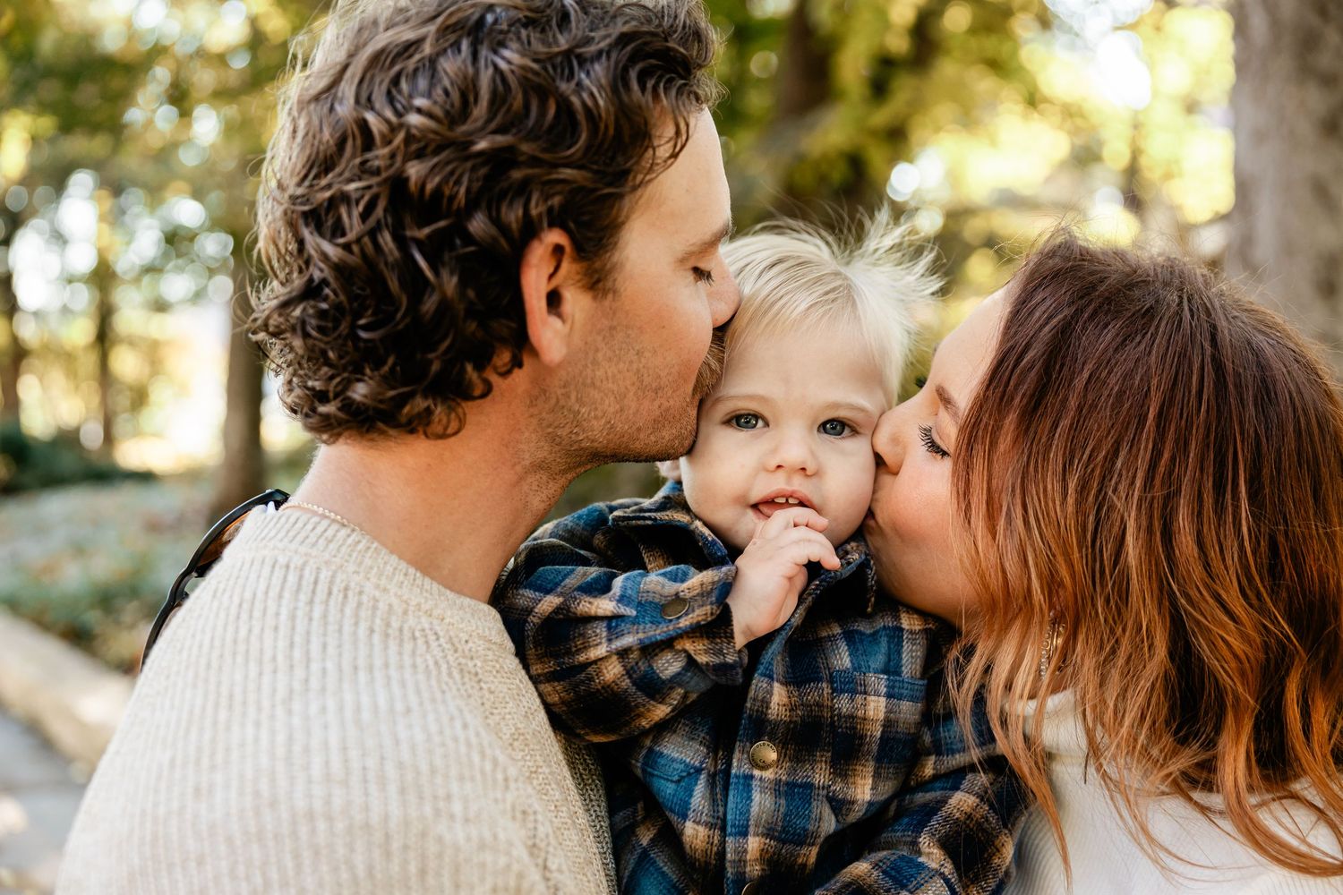 Candid family moments captured in a series of loving embraces outdoors.