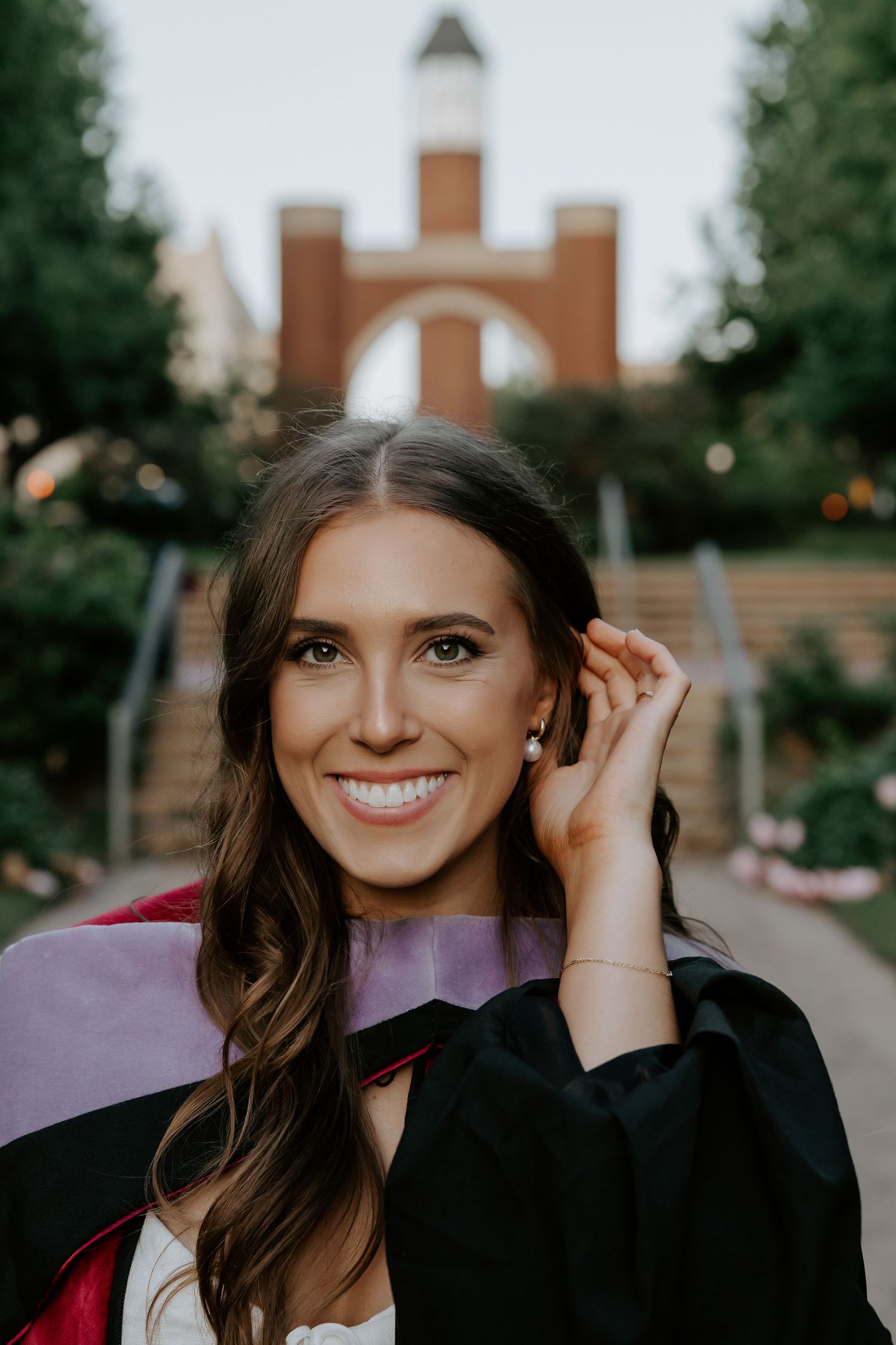 Portrait in front of brick building with natural evening lighting.
