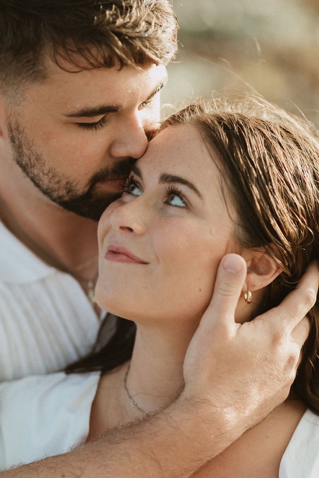 Intimate close-up portrait of couple sharing tender moments.