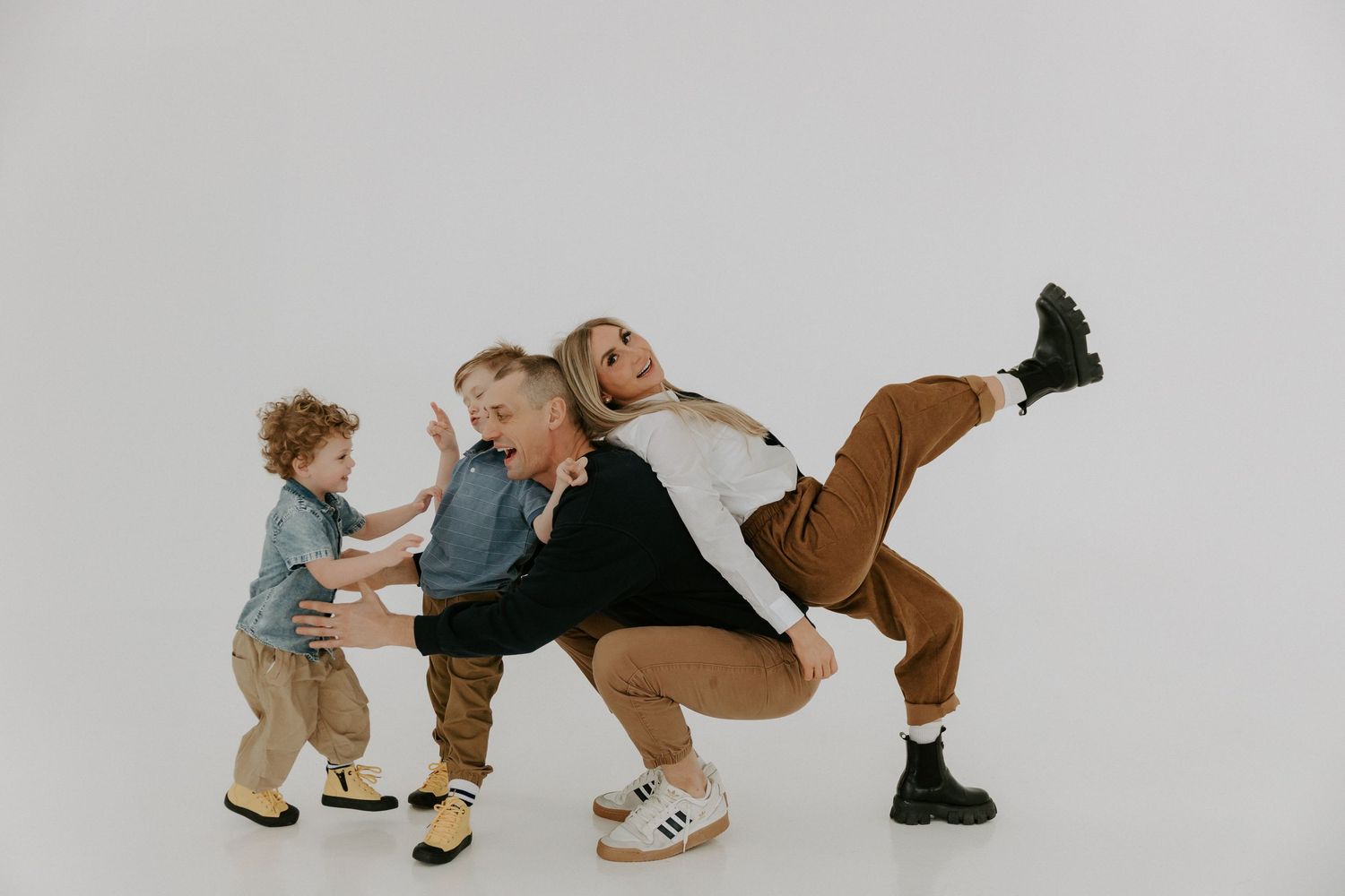 Candid movement shots of people playing and interacting on white background.