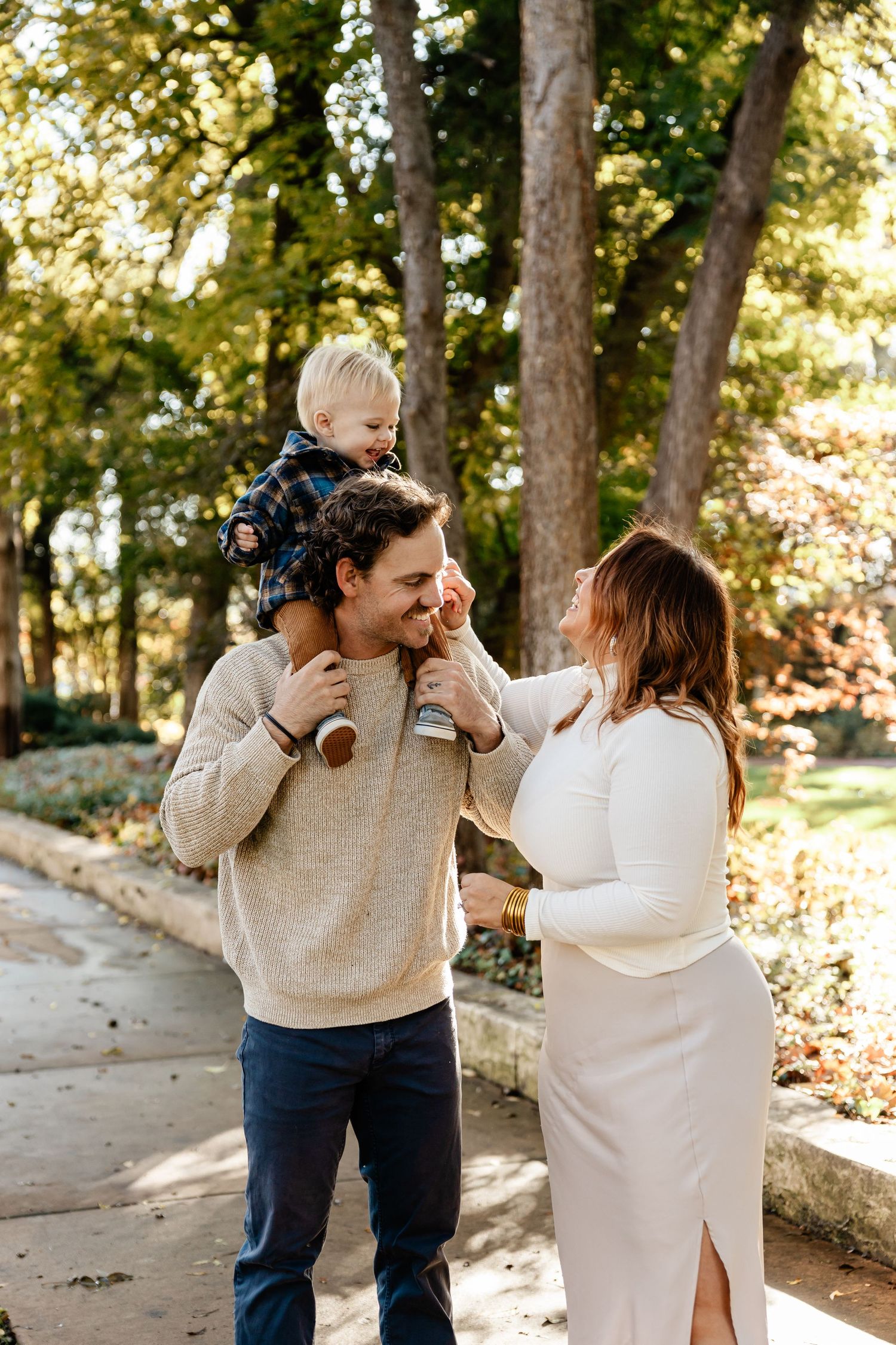 Playful family interaction series showing joyful moments in a park setting.