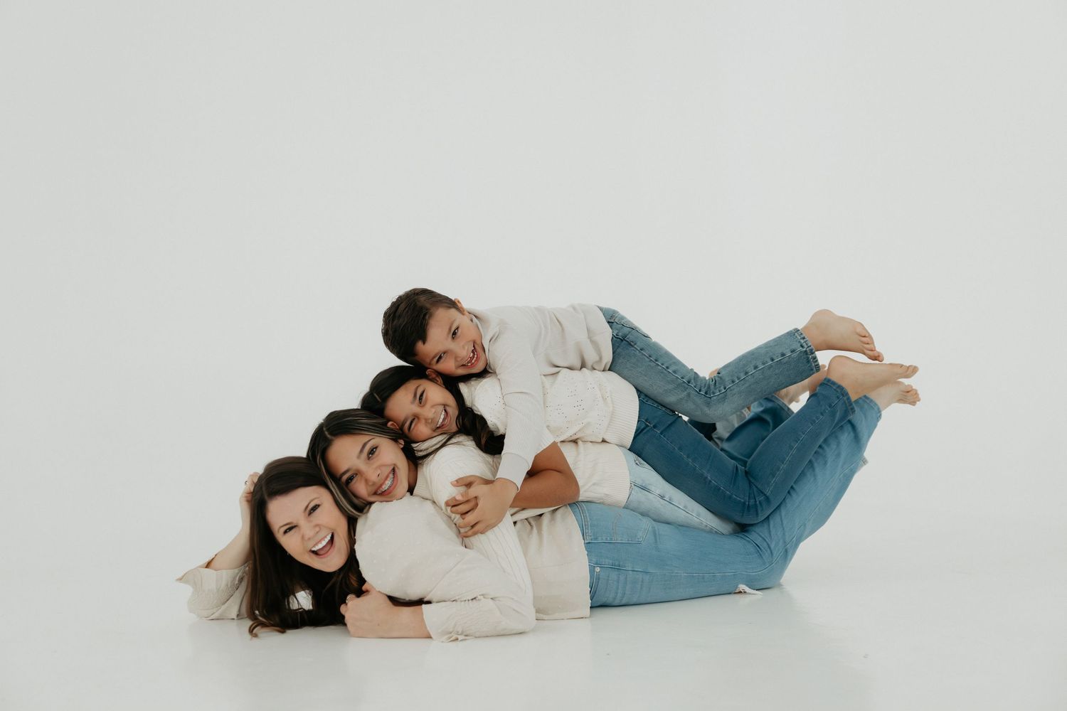 Casual couple relaxing together during an indoor studio photoshoot.
