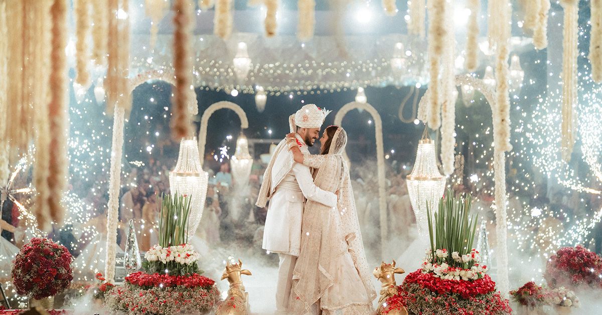 Wedding celebration with sparklers lighting up an indoor venue, beautifully captured by a wedding Photographer near me in Mumbai