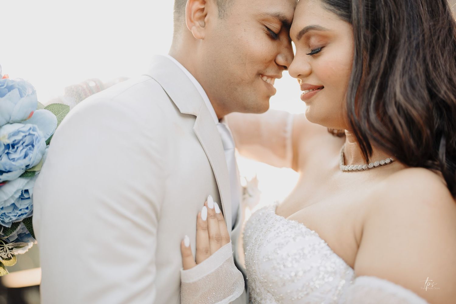 Romantic wedding couple portraits in white and blue tones with intimate close-ups, captured by a wedding Photographer in Mumbai.