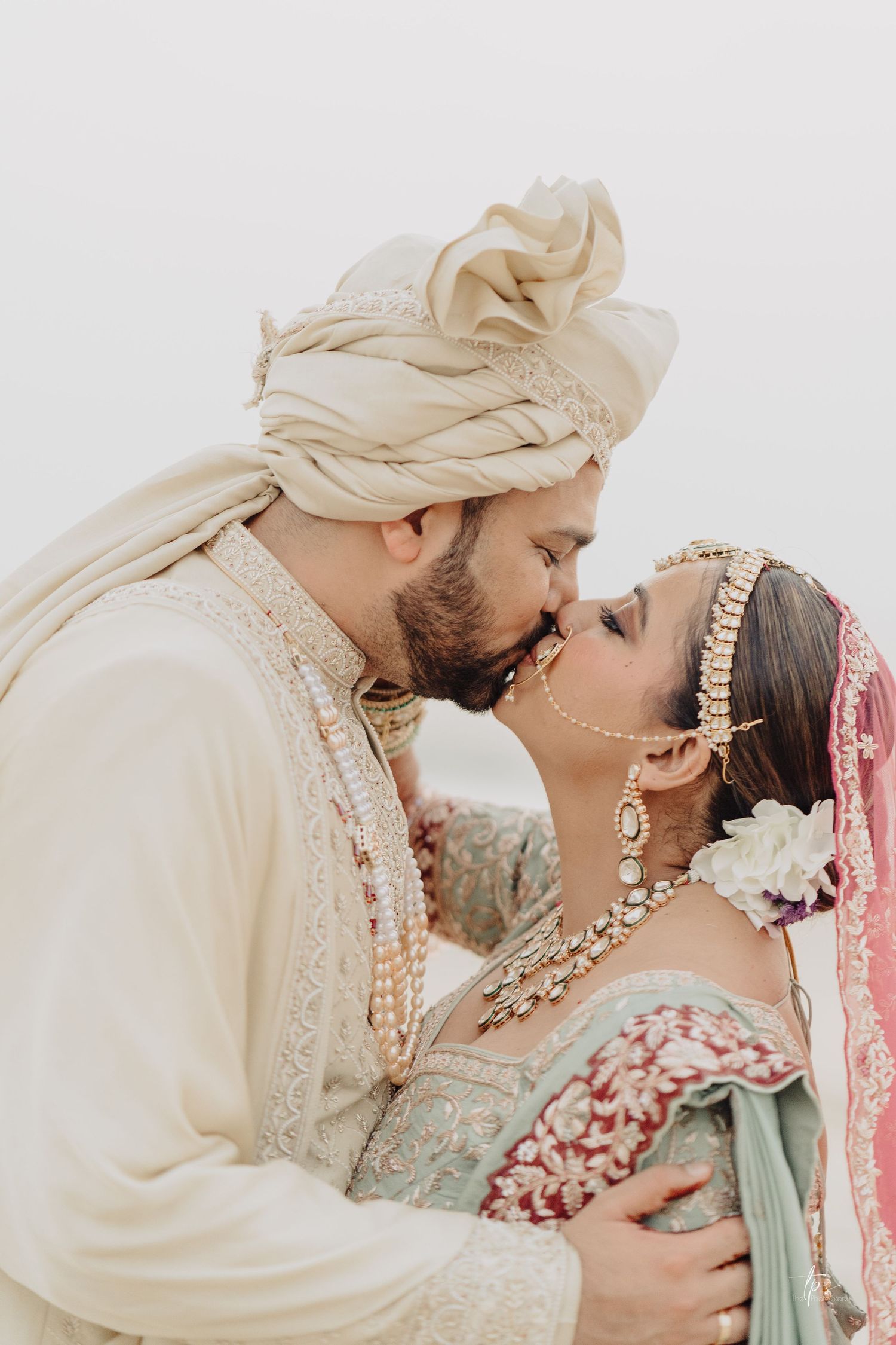 Traditional South Asian wedding couple in elegant cream outfits, captured by a wedding Photographer in Mumbai, Wedding photographer near me
