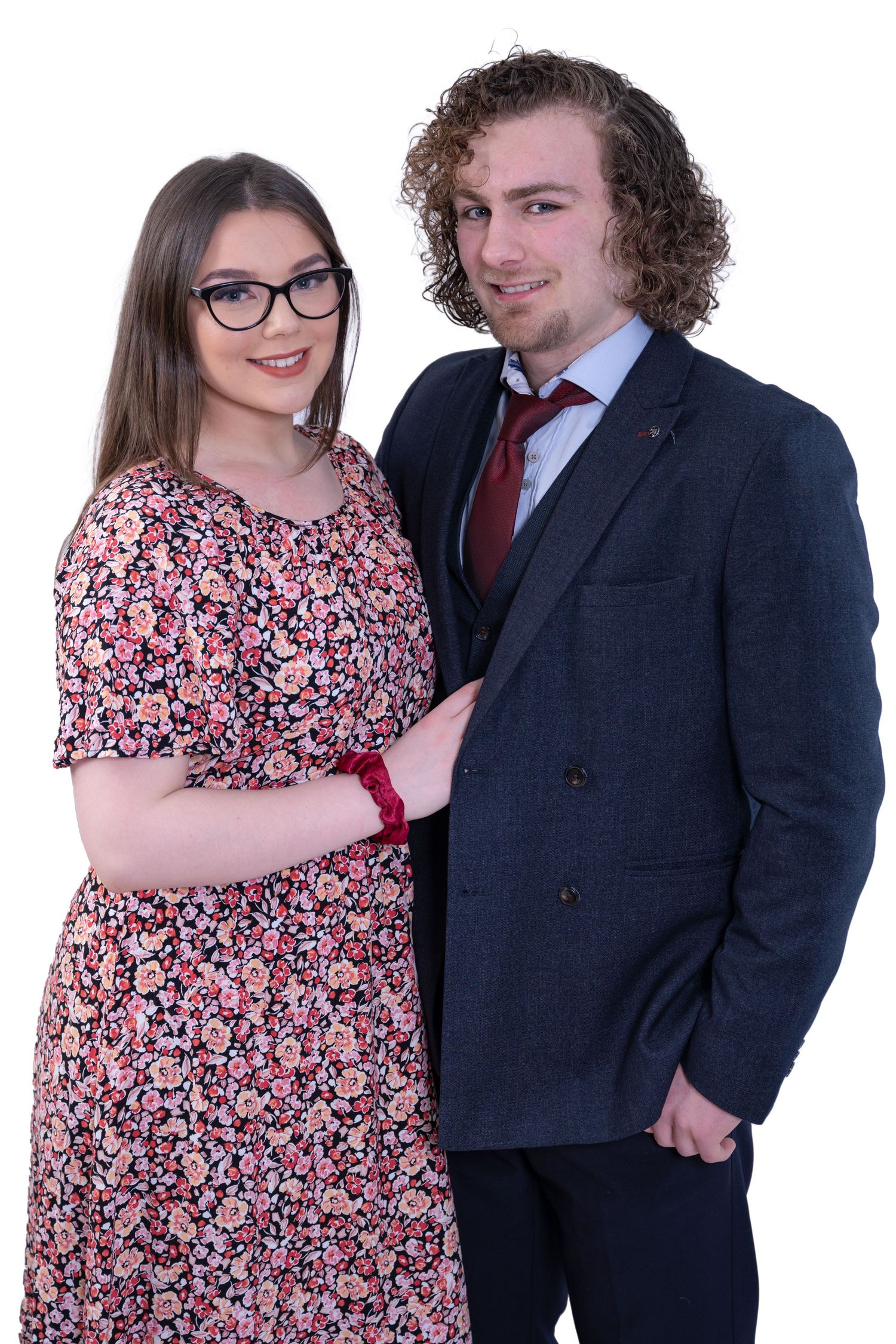 Studio portrait sequence showing couple in floral dress and navy suit against white background.