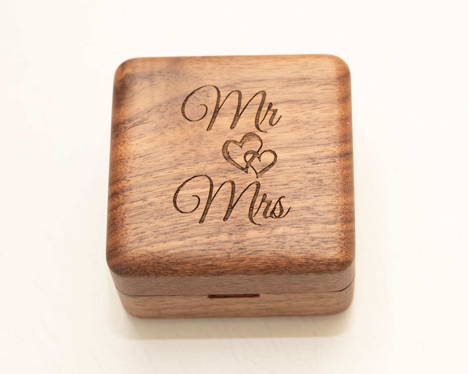 Wooden ring boxes with 'Mr' and 'Mrs' engraved on them.