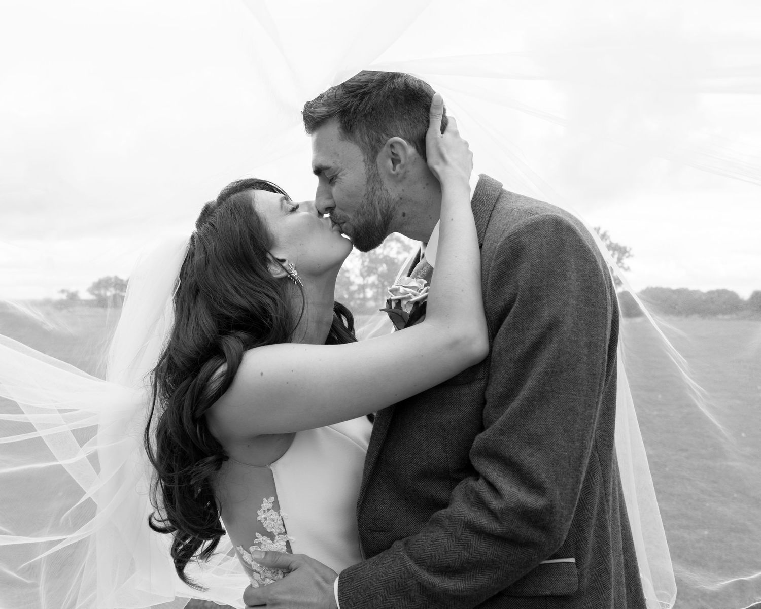 Black and white romantic wedding photos showing tender moments between newlyweds.