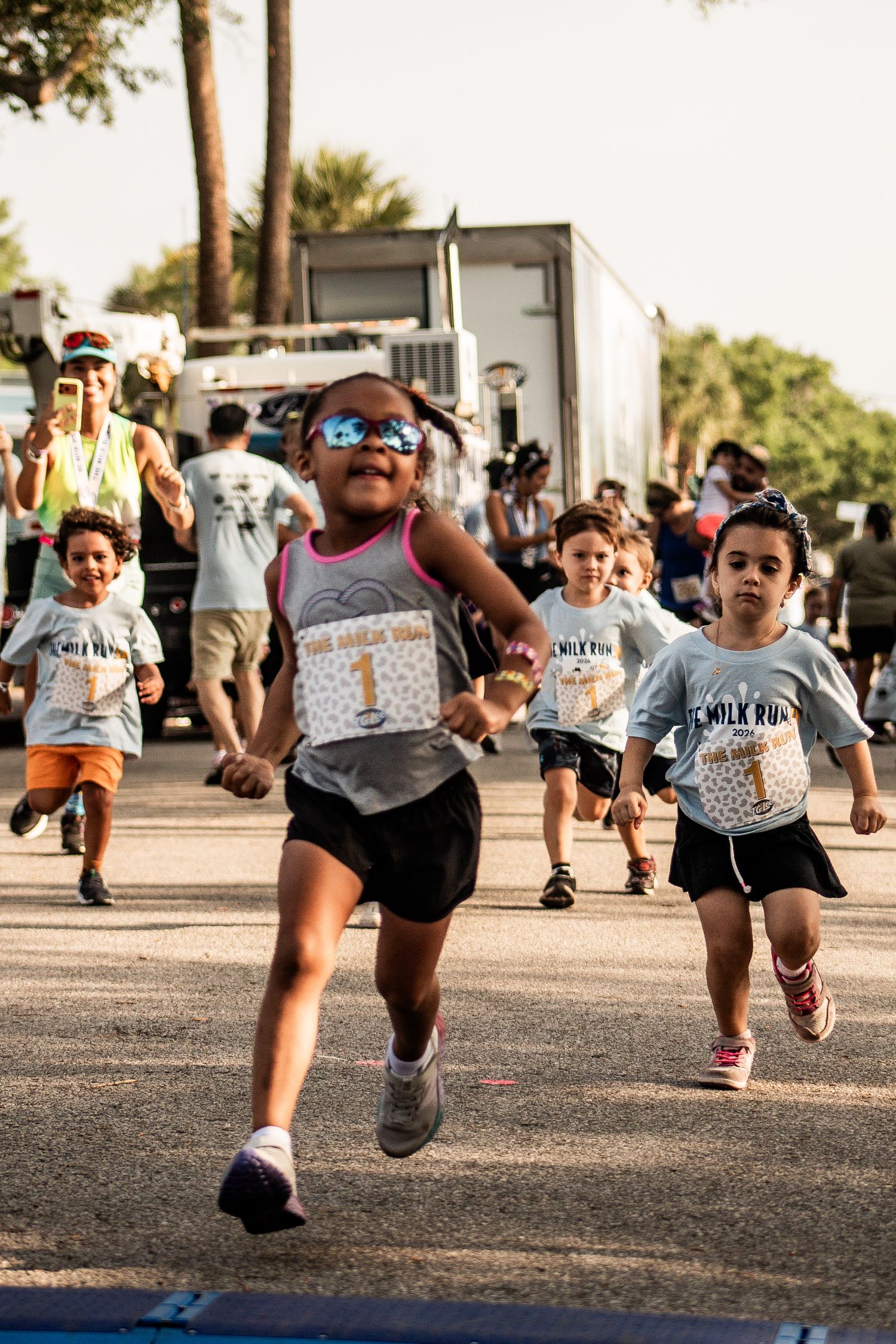 Children racing toward the finish line during the T.G. Lee Milk Run 5K event in Central Florida. Goodreau.co