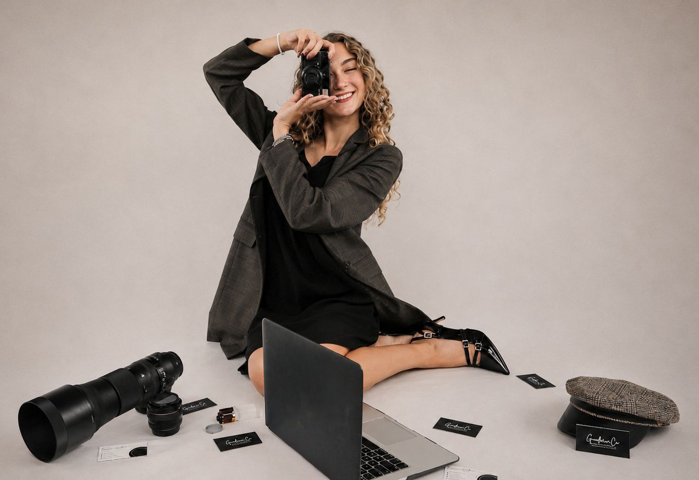 Brianna Goodreau holding a Canon camera, photographer and founder of Goodreau.co