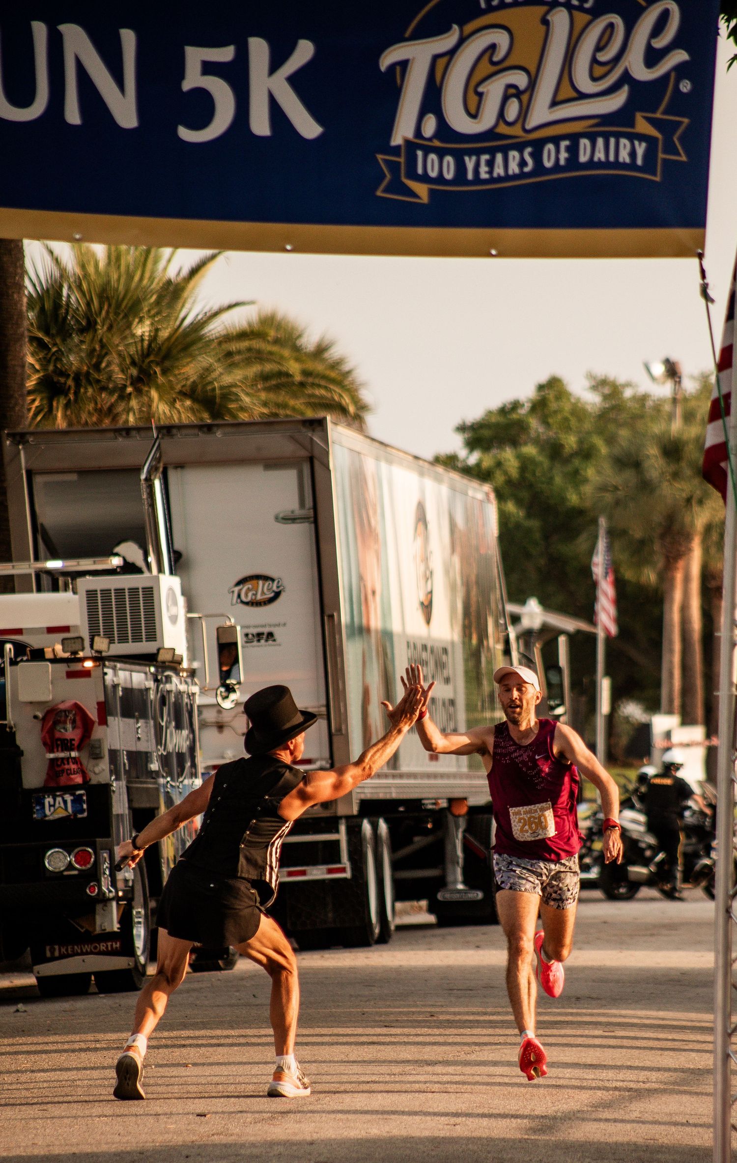 Runner receiving a high-five near the finish line during the T.G Lee Milk Run 5K race in Orlando, Florida. Goodreau.co