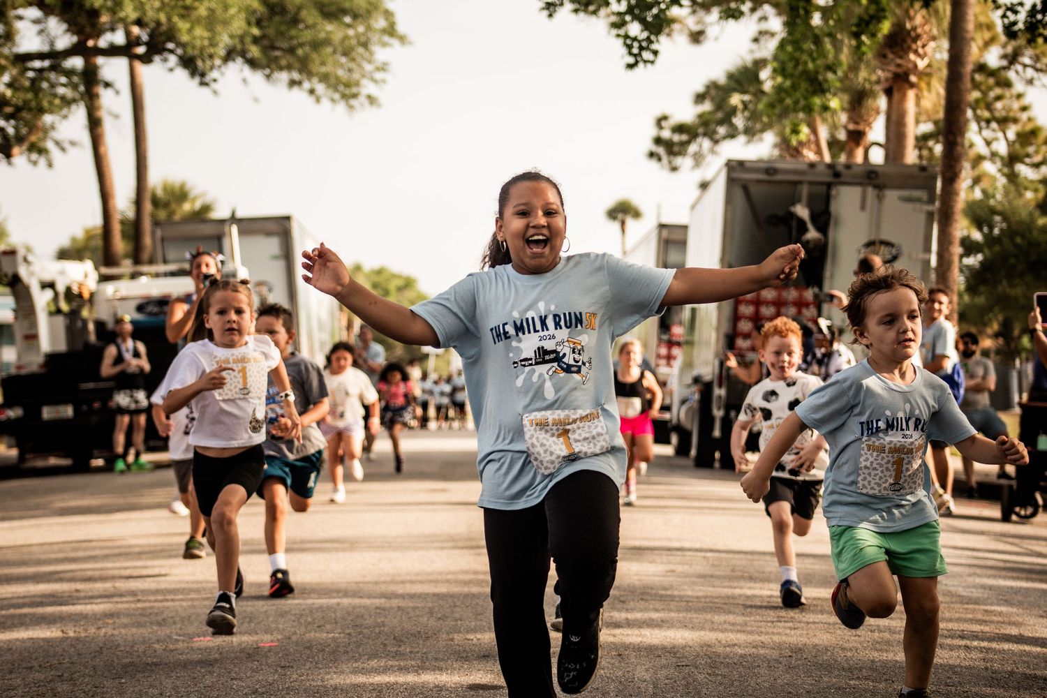 Children racing toward the finish line during the T.G. Lee Milk Run 5K event in Central Florida. Goodreau.co