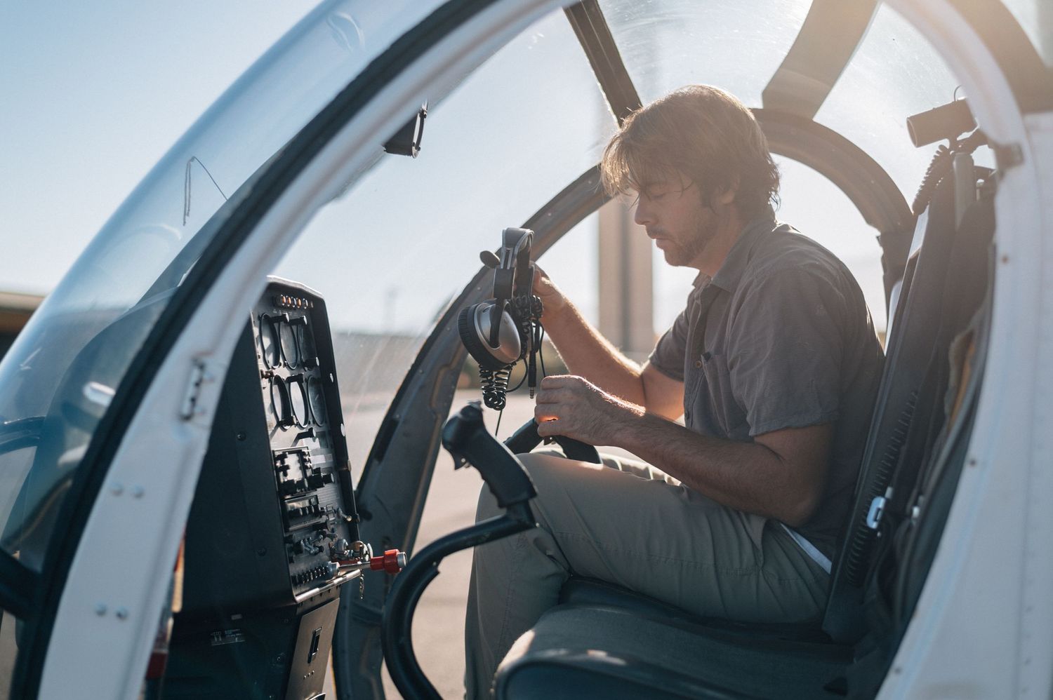 Interior view of helicopter cockpit during pre-flight checks.