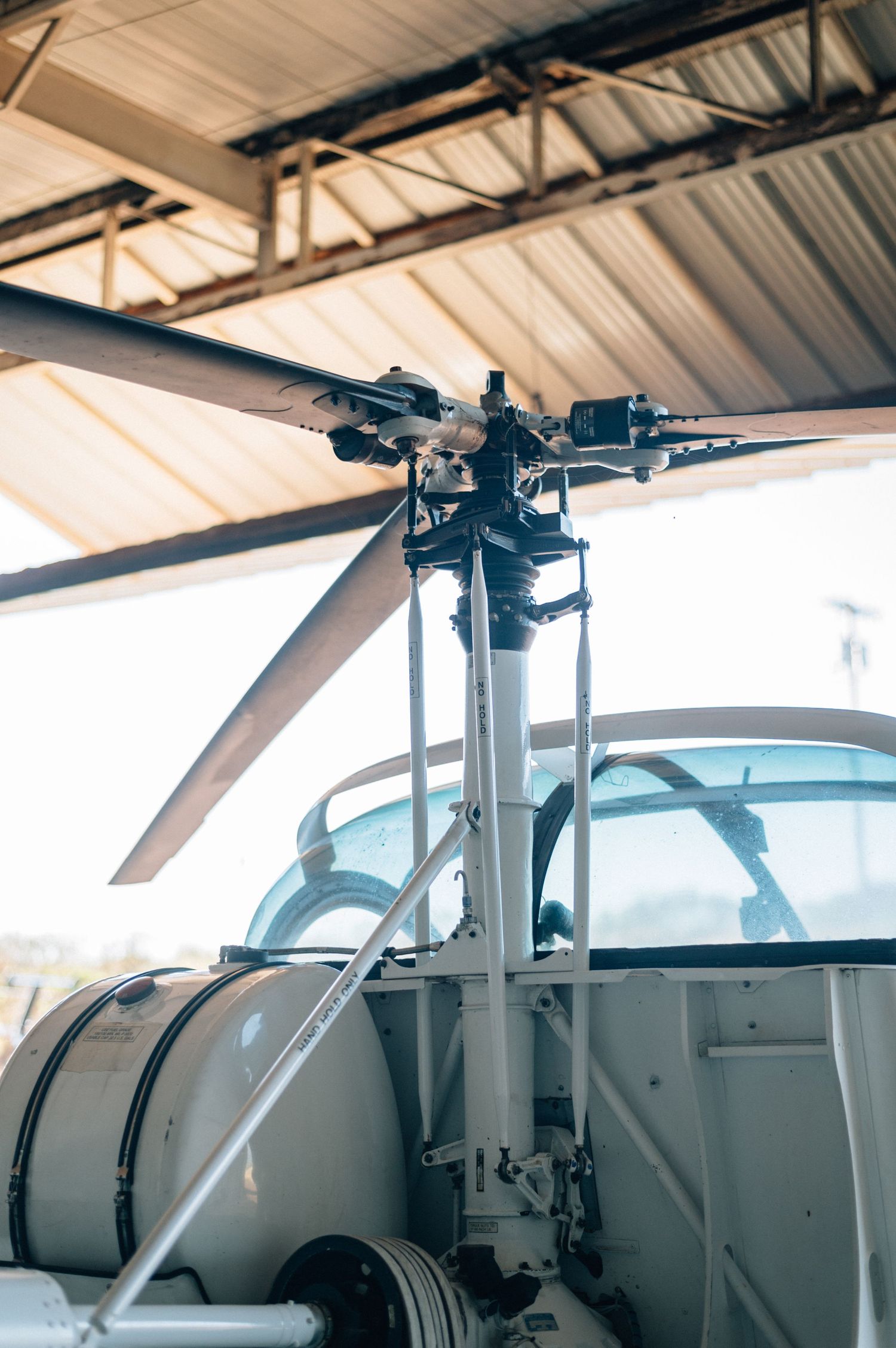 Close-up view of a small aircraft's overhead control panel and instruments in a cockpit.