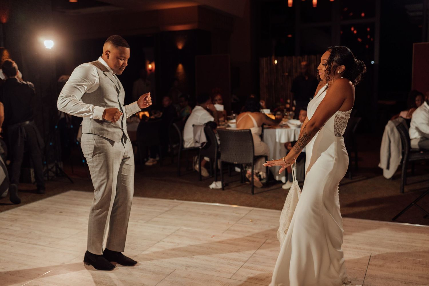 Bride and groom share their first dance at elegant wedding reception venue.