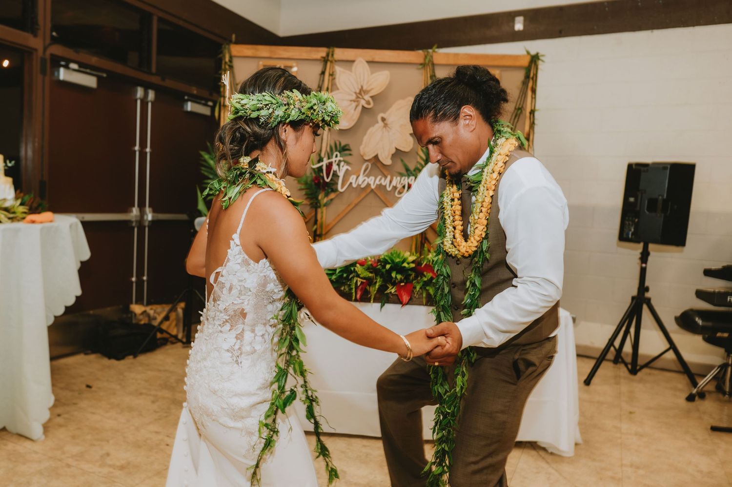 Couples dancing together at a lively wedding reception celebration.