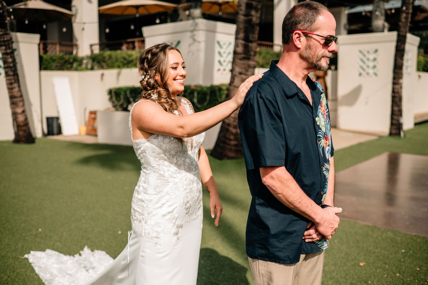 Emotional wedding reveal moment captured in a series of candid photographs.