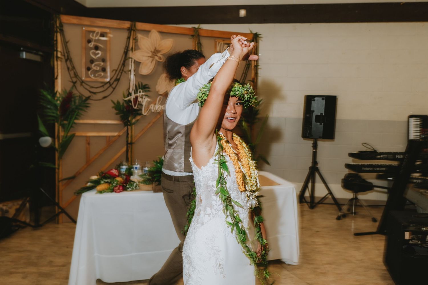 Wedding celebration with guests dancing and enjoying themselves on the dance floor.