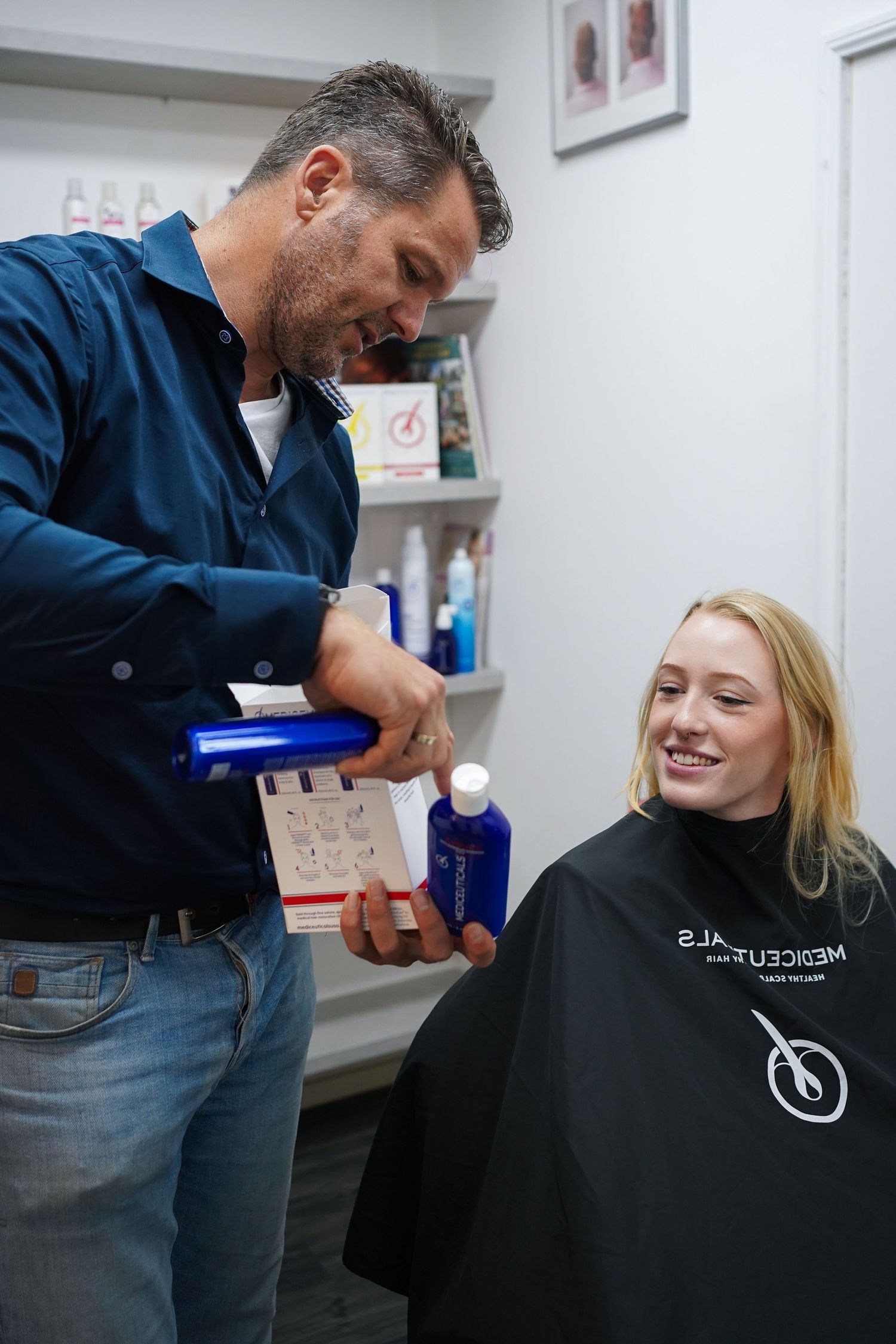 Stylist consulting with client before treatment, hair salon commercial photography