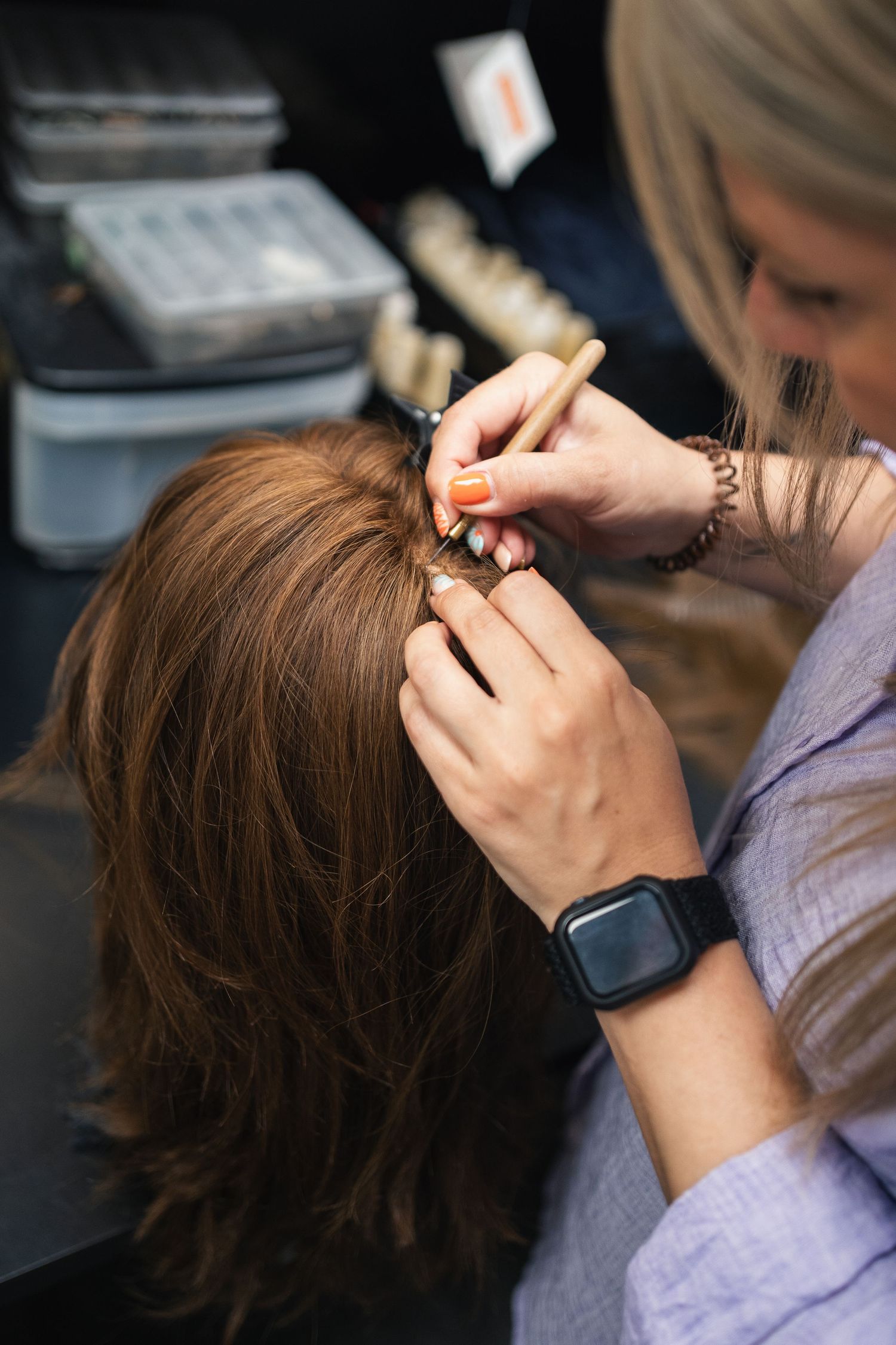 Stylist fitting a custom wig, commercial photography for hair salons