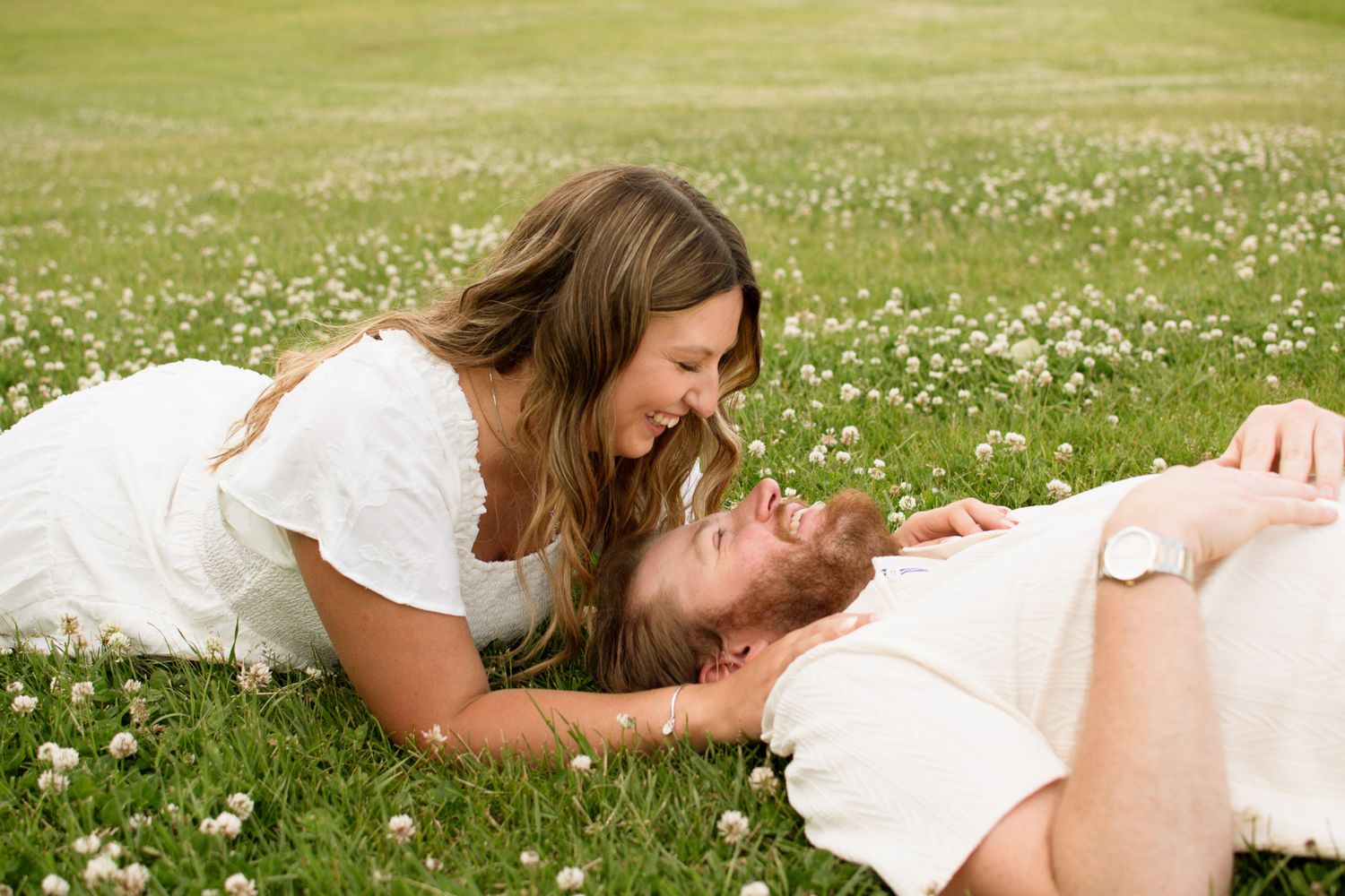 Couple laughing together during a candid photography session