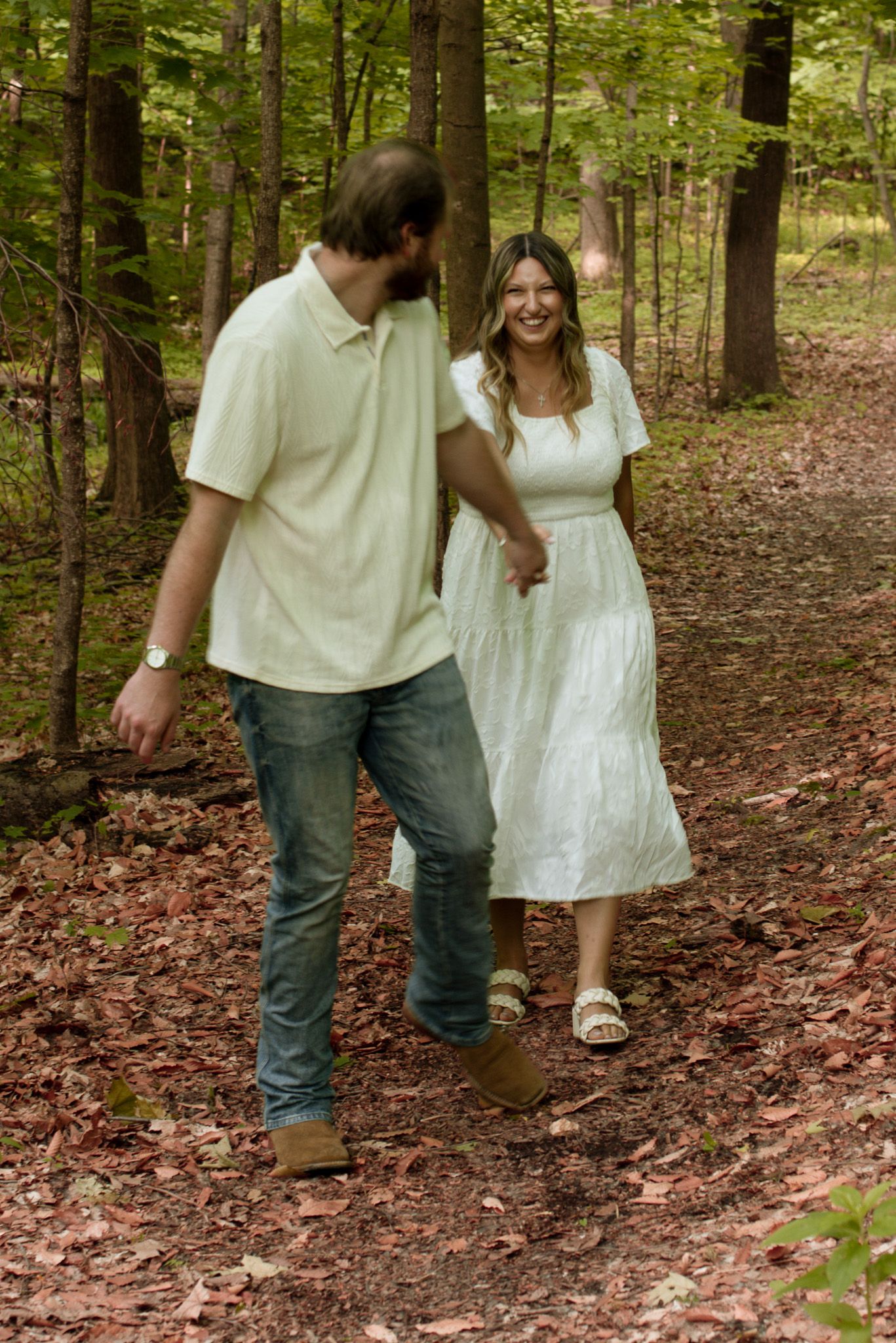 Couple laughing together during a candid photography session