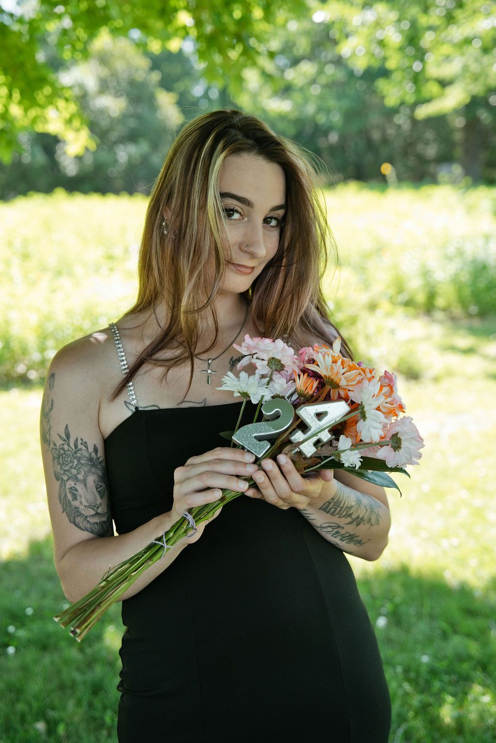 Portrait of Shutter District photographer holding flowers
