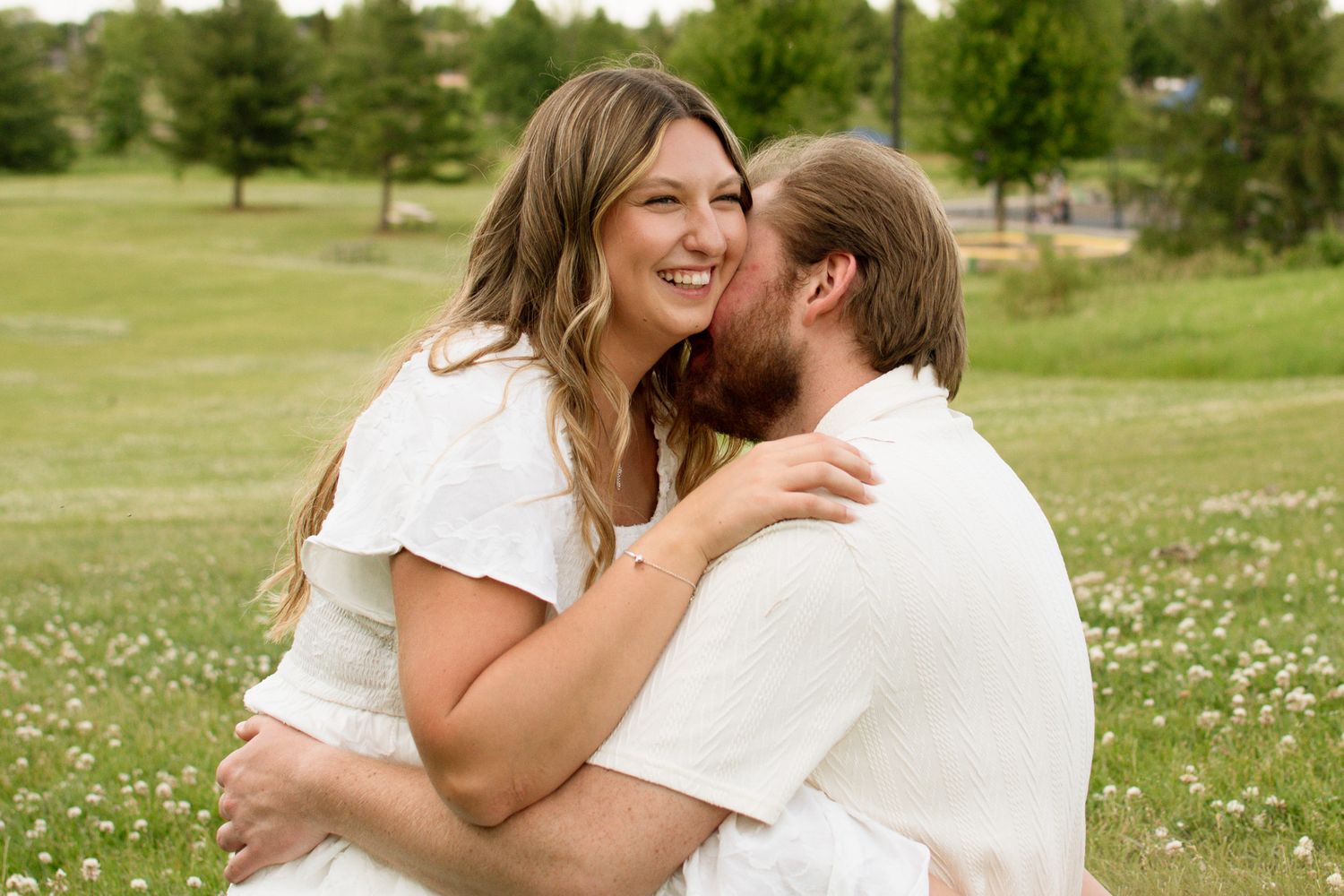 Couple laughing together during a candid photography session