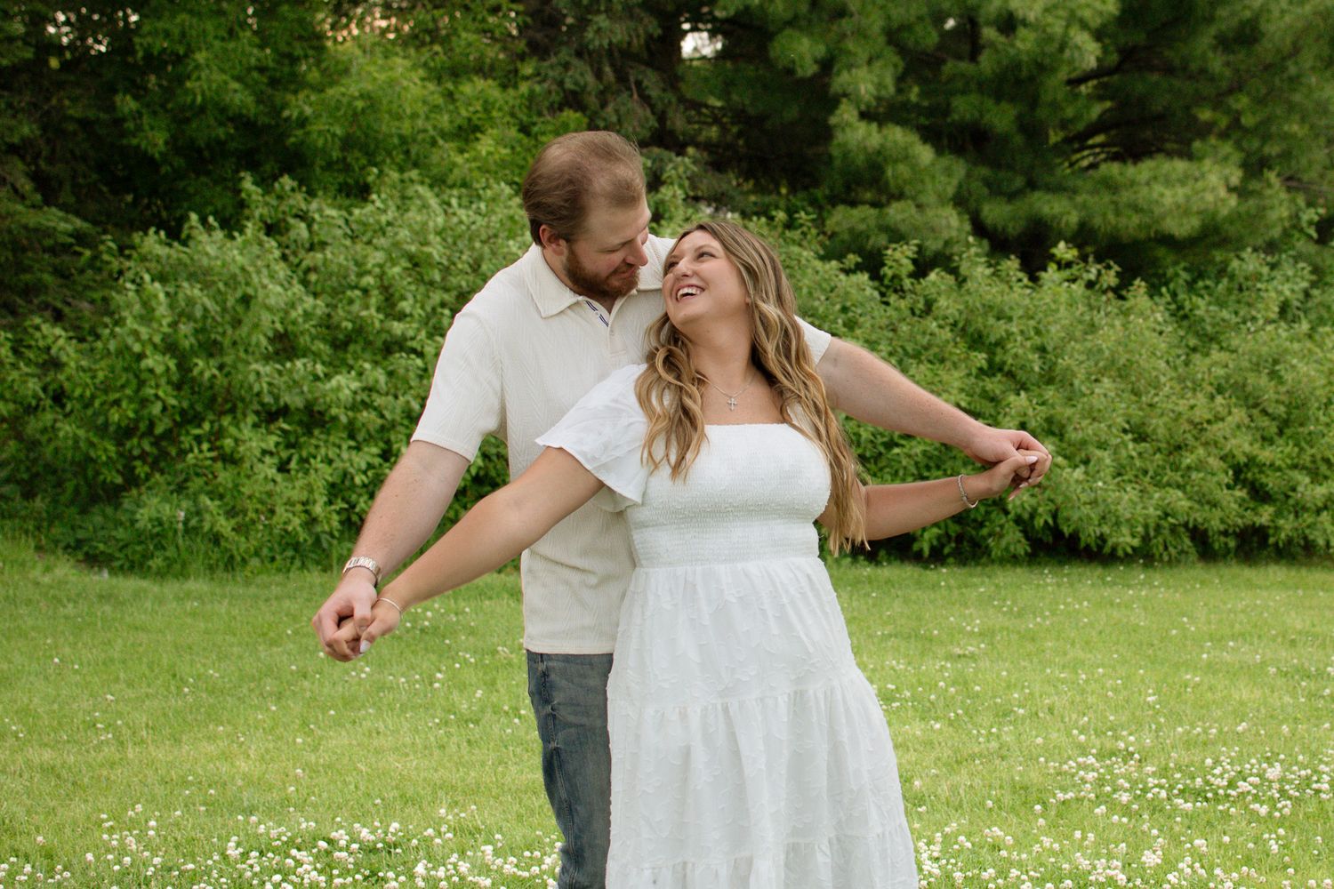 Couple laughing together during a candid photography session