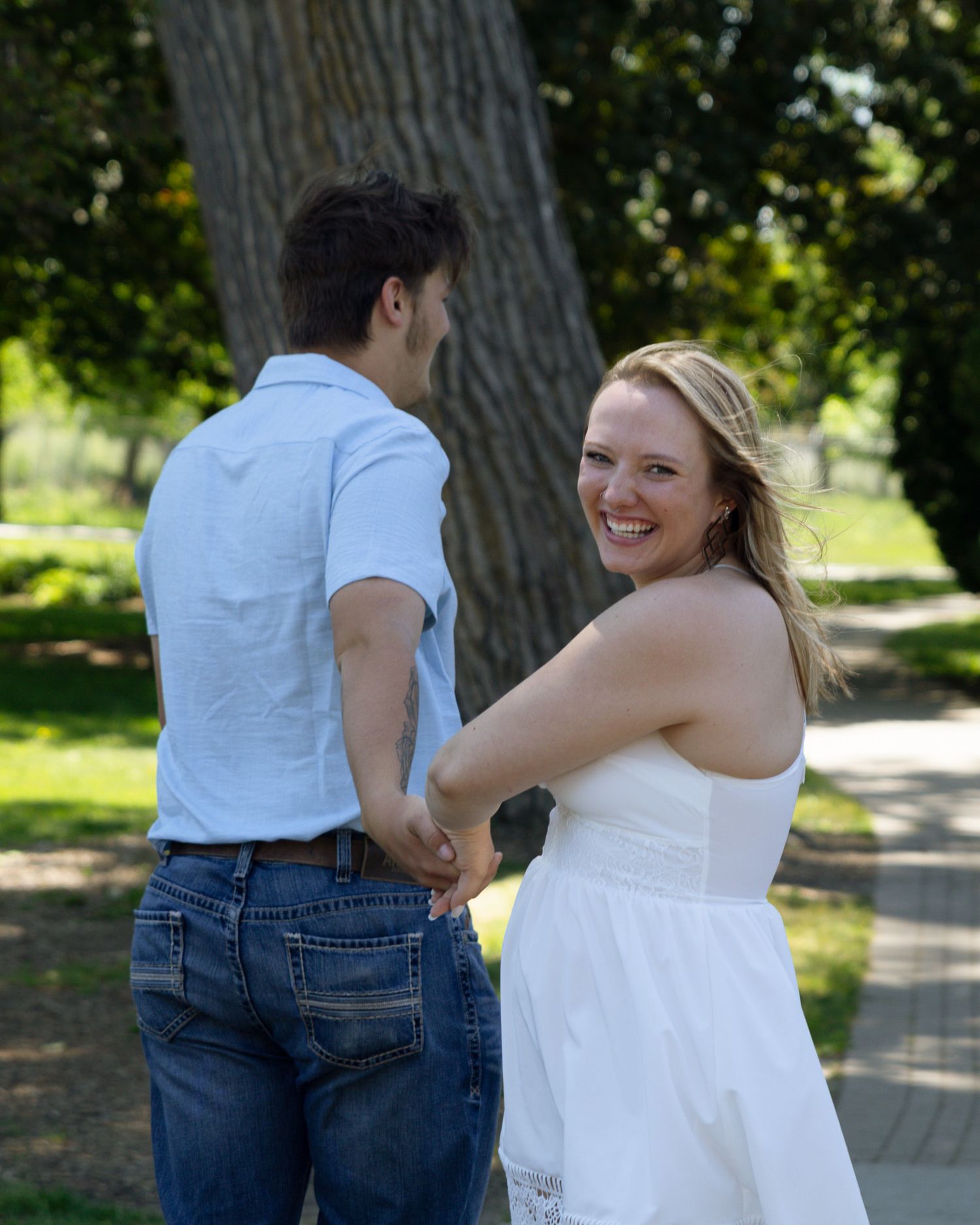 Couple laughing together during a candid photography session