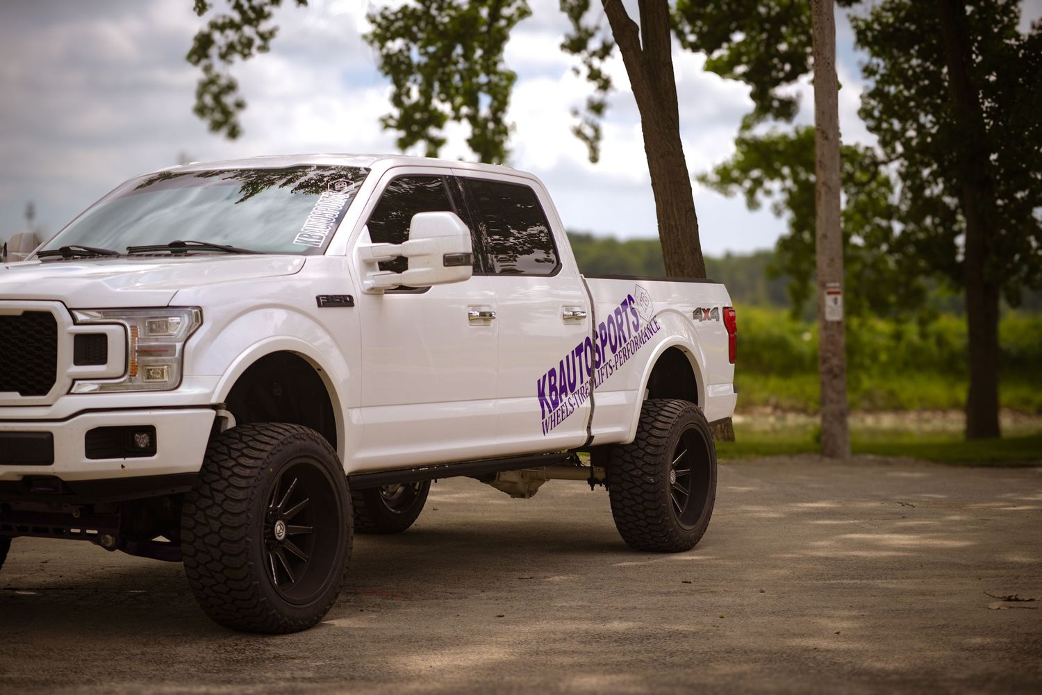 White Ford F150 truck with KBAutoSports logo for a branding session.