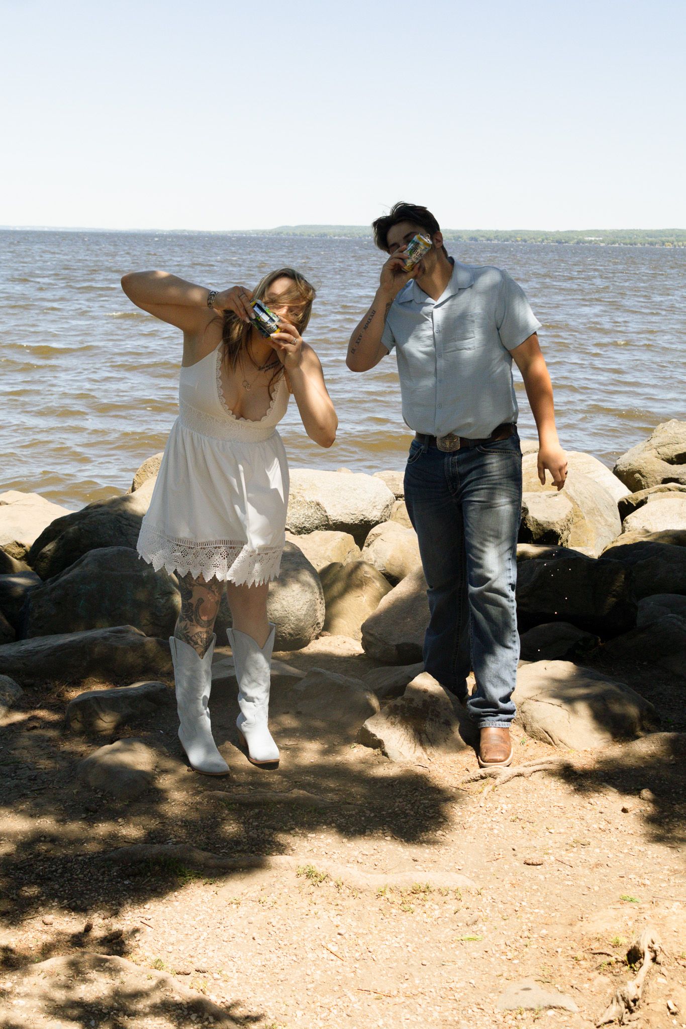 Couple celebrating with drinks during a photography session