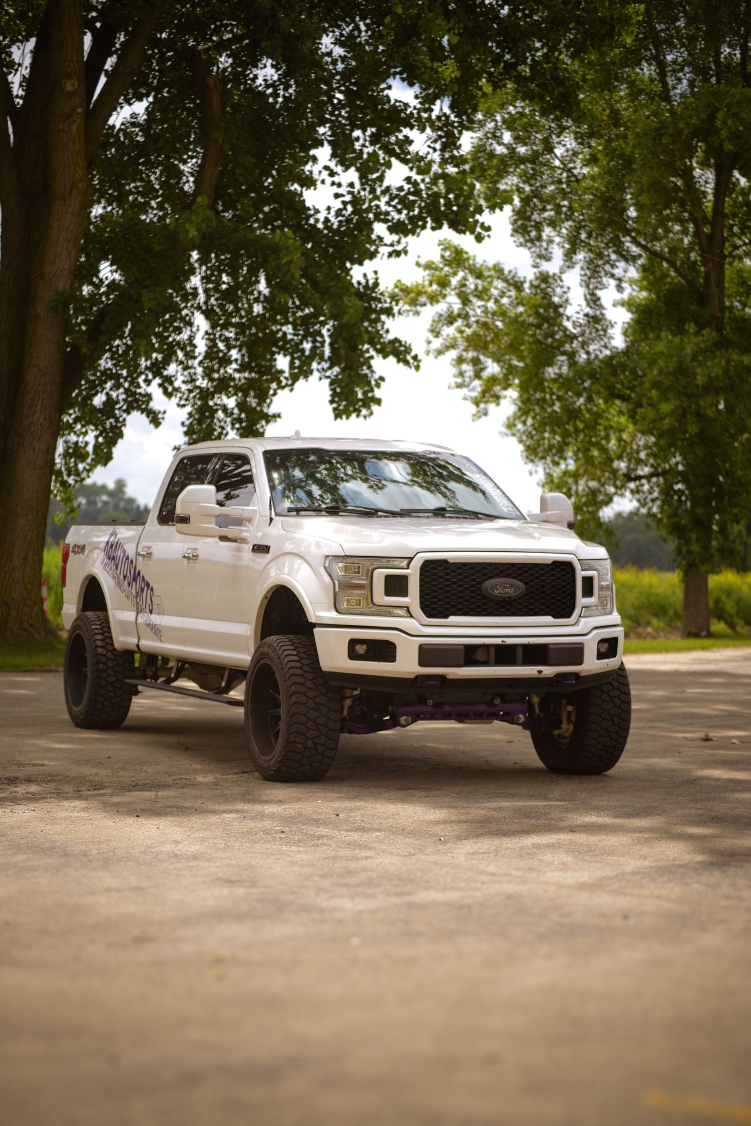 White Ford F150 truck with KBAutoSports logo for a branding session.