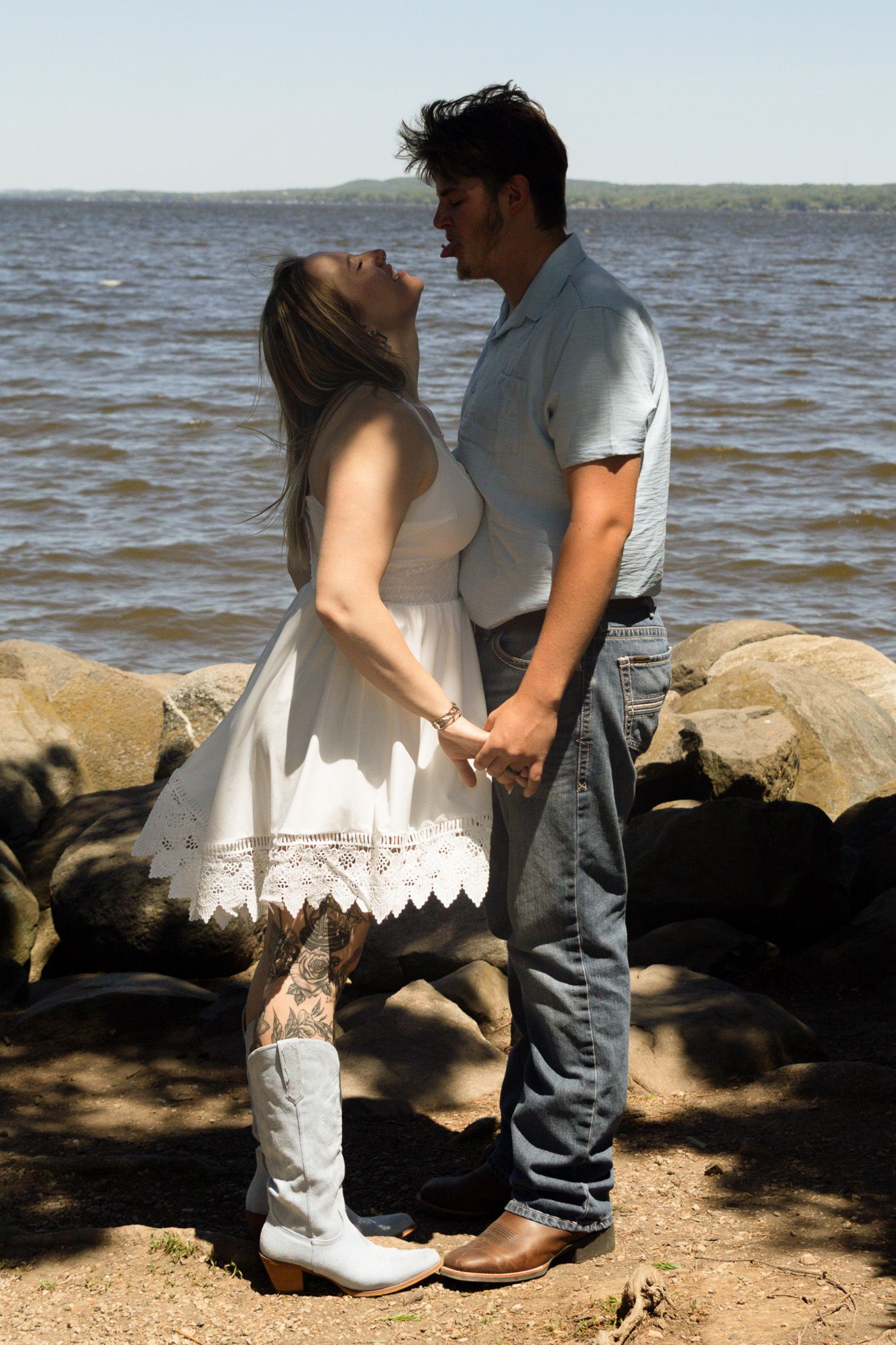 Couple laughing together during a candid photography session